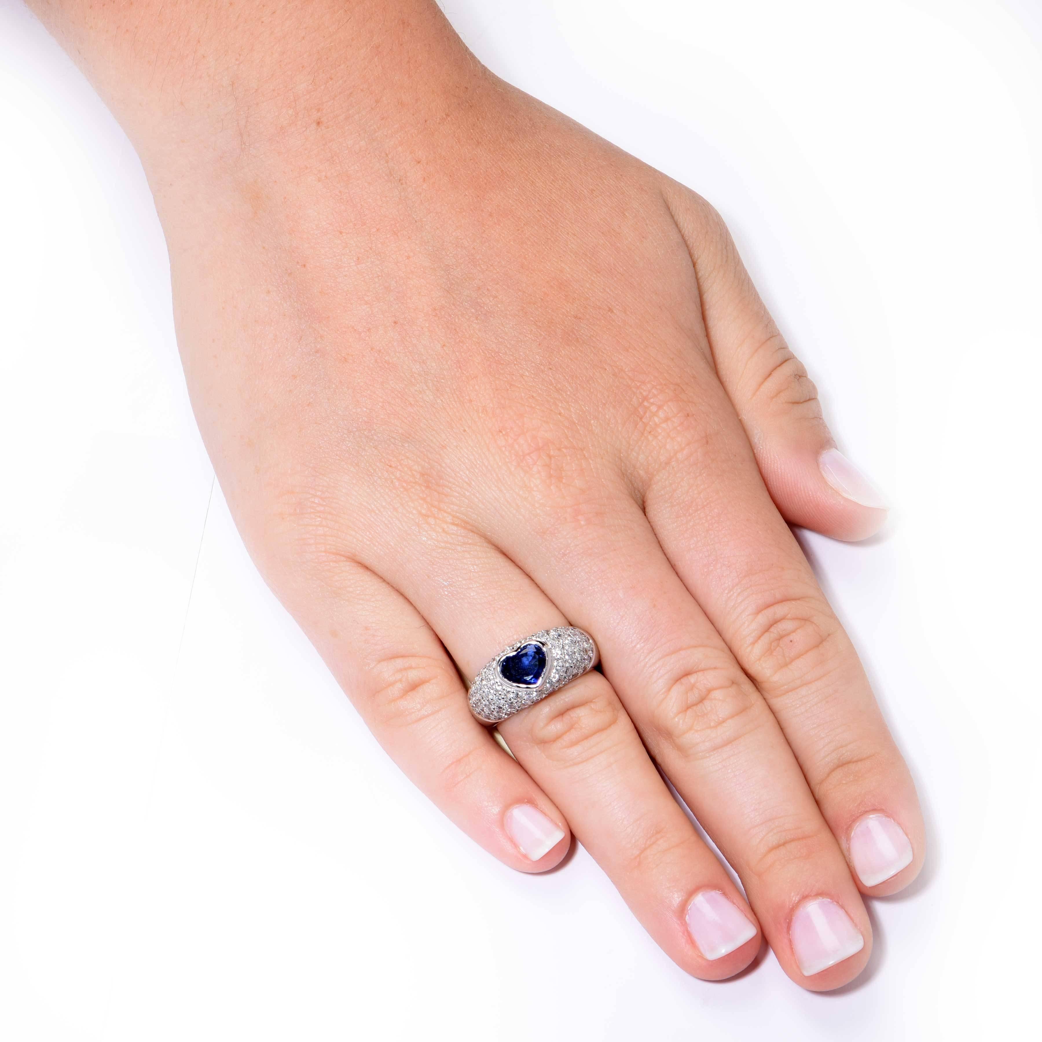 This lovely ring features a Blue Sapphire weighing approximately 1.5 carats and 80 round cut diamonds with an approximate weight of 1.3 carats set in 18 Karat White Gold.

Ring Size: 6 3/4 (can be sized)
Metal Type: 18 KT White Gold (stamped and/or