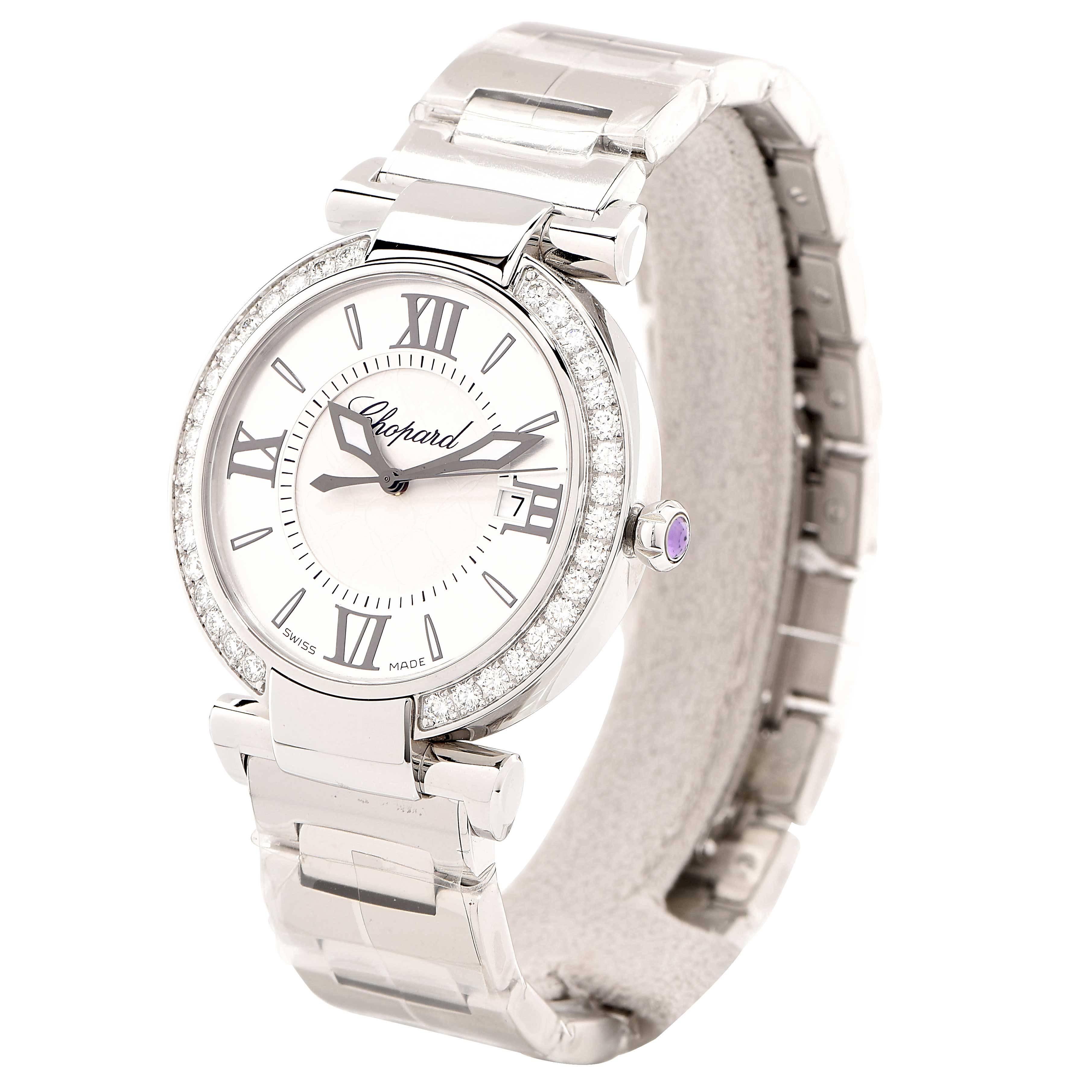 New Chopard Imperiale with Box and Papers.
The diamond-set bezel of this IMPERIALE watch in stainless steel with a stainless-steel bracelet adds a touch of refined brilliance to the pure lines of its sculptural design. On the silver-toned dial, its