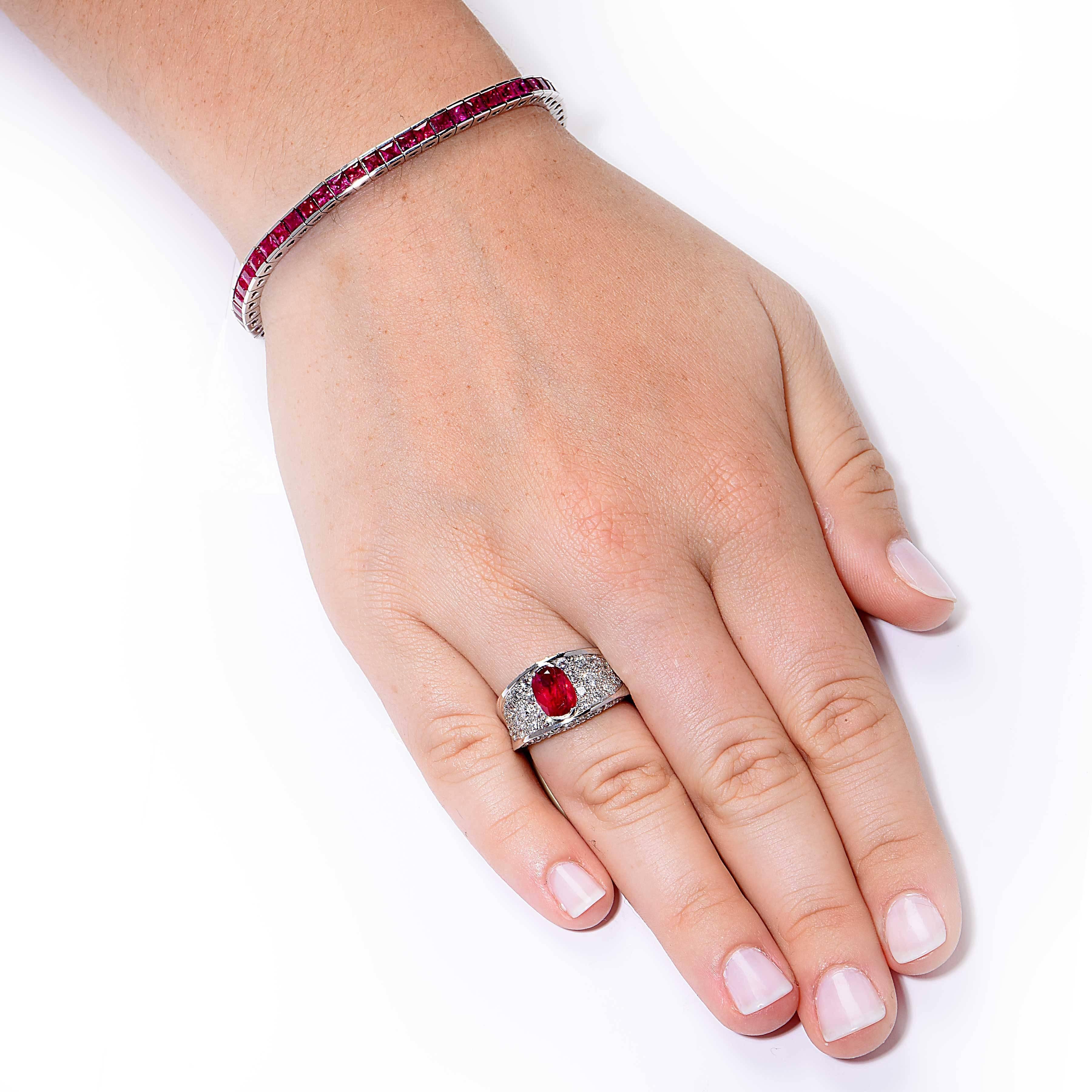 This beautiful ruby ring features a 2.35 carat oval cut natural ruby and round brilliant cut diamonds with an estimated total weight of 1.75 carats.

Ring Size: 6 (can be sized)
Metal Type: 18 KT White Gold  (stamped and/or tested)
Metal Weight: 9.7
