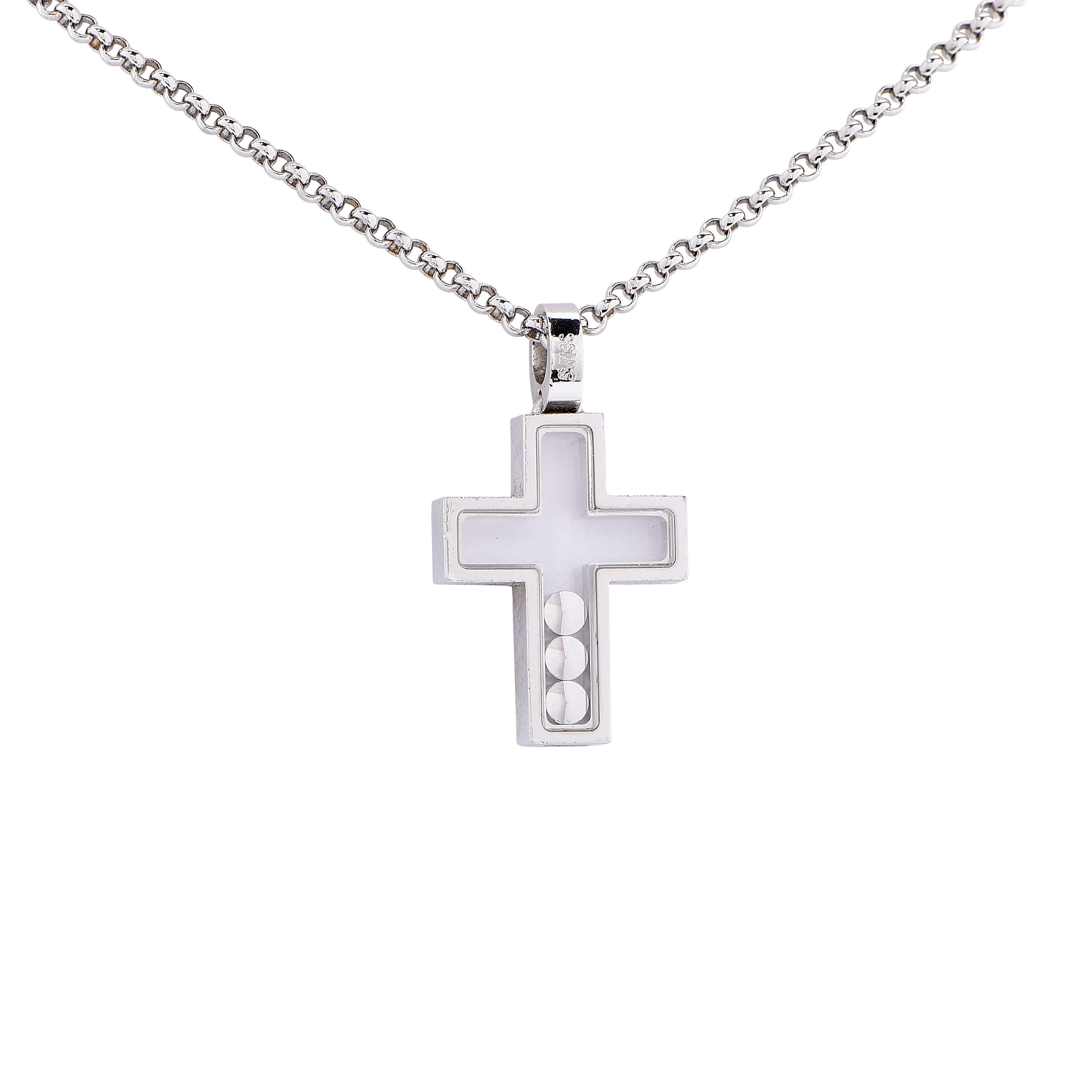 Classic Chopard Happy Diamonds Cross necklace features 3 floating diamonds with a total weight of .17Cts set in 18 Kt White Gold. Mounted in 16.5 inch long rolo link chain.
Pendant is 27mm long

Metal Type: 18Kt White Gold
Metal Weight: 12.2 Grams