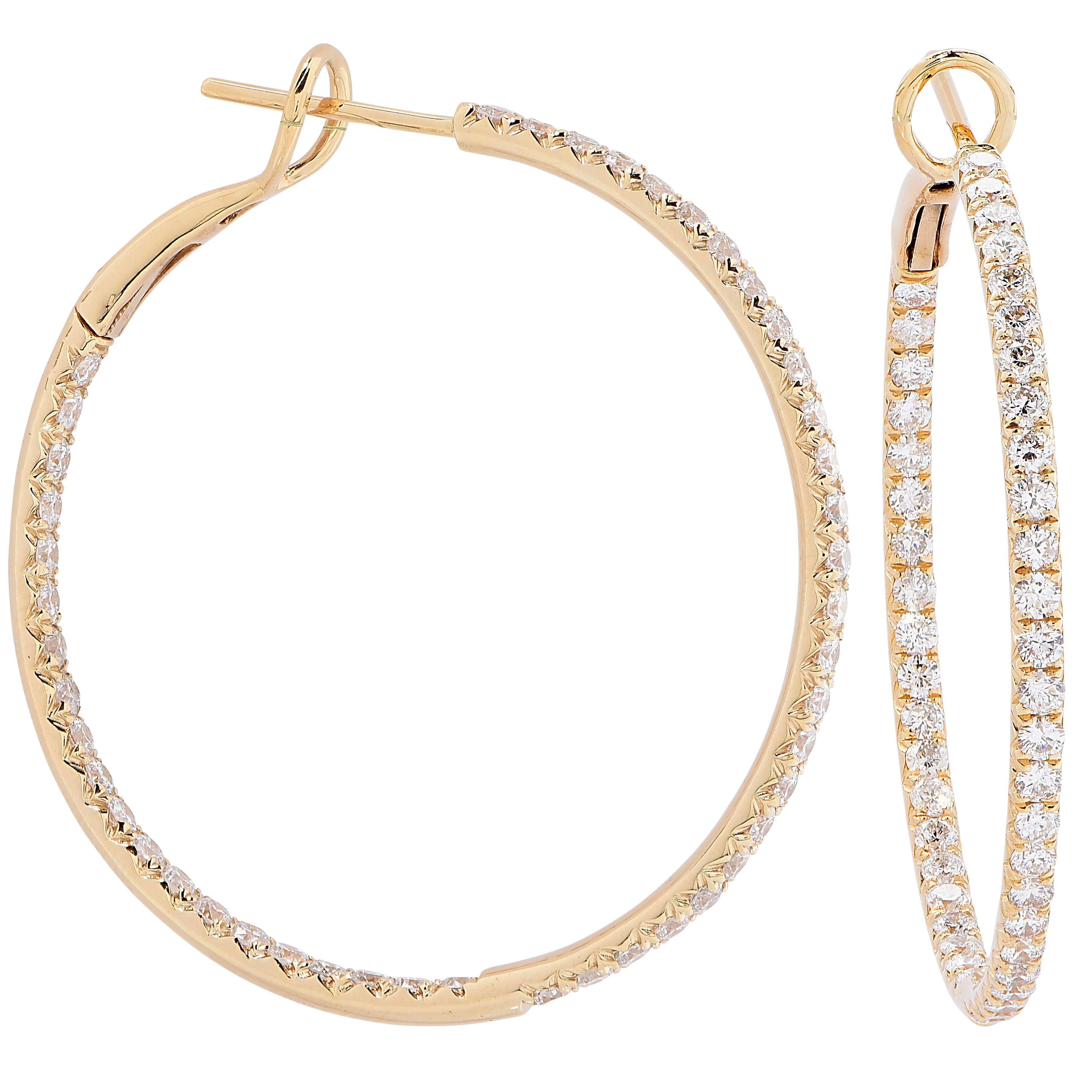 2 Carat Diamond Hoop earrings featuring 92 round cut diamonds set in 18 KT Yellow Gold.

Metal Type: 18Kt yellow Gold
Metal Weight" 6.5 Grams