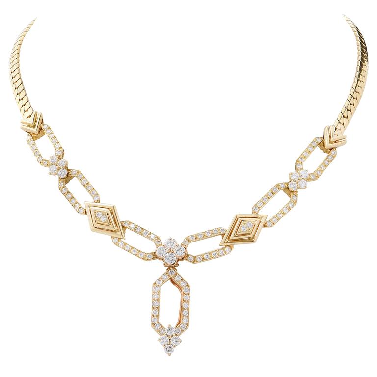 This delightful suite of Mecan Elde French diamond jewelry features a necklace, bracelet and earrings. 
Total Diamond Weight is 10.35 Carats in 265 round brilliant cut diamonds.
Necklace length is 15 1/4 inches and bracelet length is 7 1/8