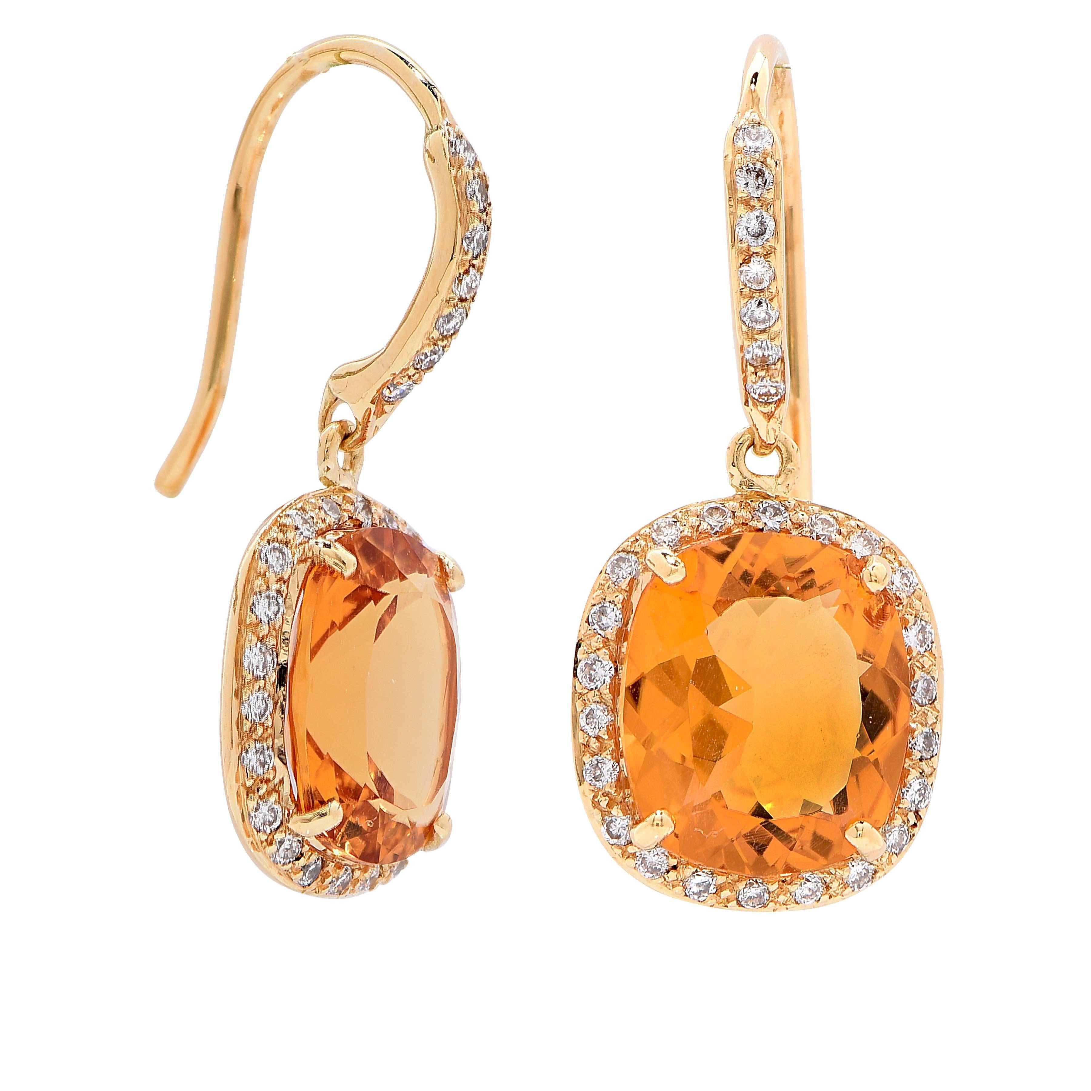Citrine and diamond 18 karat yellow gold earrings featuring two cushion cut natural citrines with an estimated total weight of 6 carats surrounded by 58 round cut diamonds with an estimated total weight of .32 carat.

Metal Type: 18 Kt Yellow
