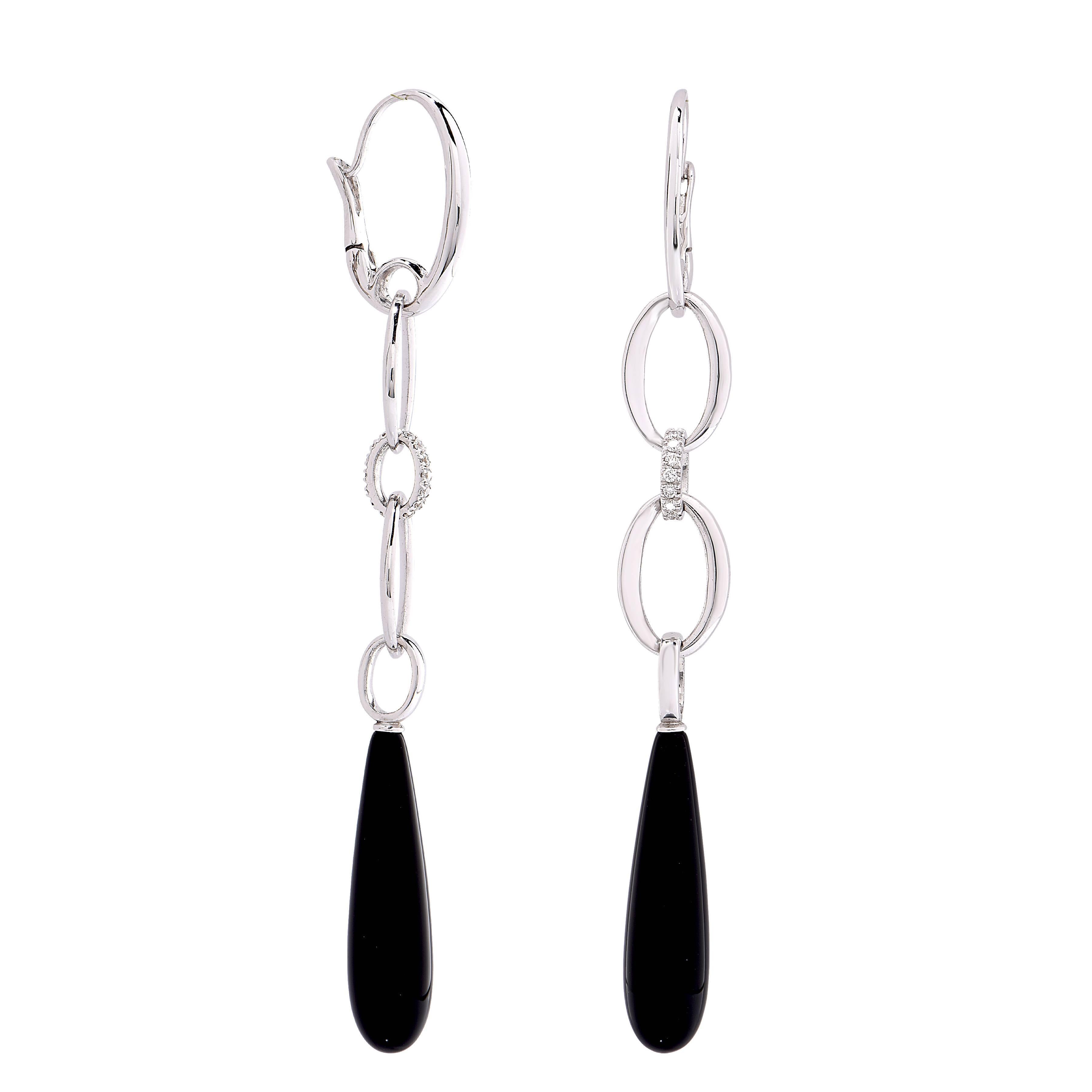 Onyx and Diamond 18 Karat White Gold drop earrings featuring two tear drop shaped onyx pieces with a total weight of 4.7 carats and 24 round cut diamonds with an estimated total weight of .28 carat.

Metal Type: 18Kt White Gold
Metal Weight: 14.5