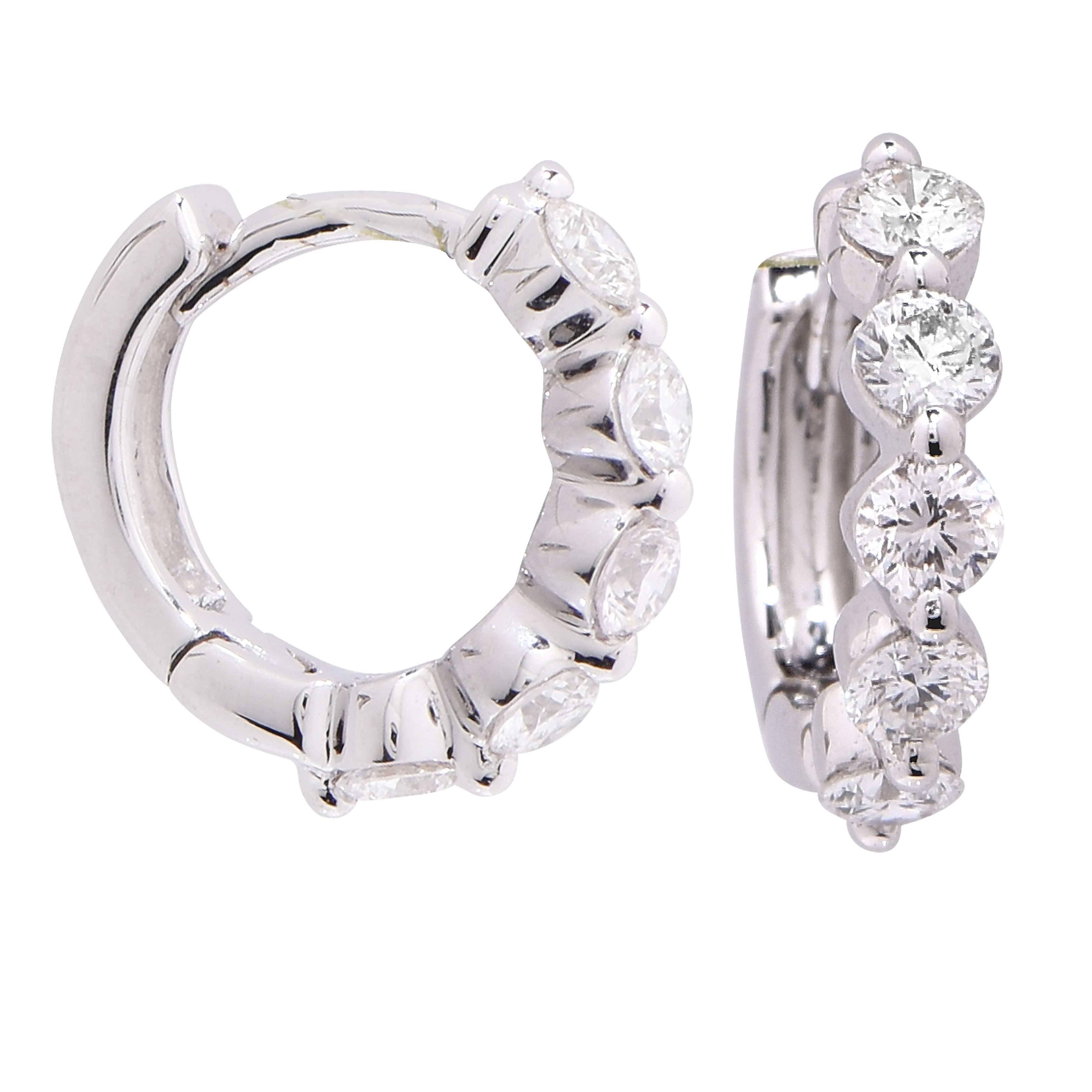 Small Diamond hoop earrings featuring 10 round brilliant cut diamonds with an estimated total weight of .6 carat set in 18 Karat White Gold.

Metal Type: 8 Karat White Gold Stamped or Tested
Metal Weight: 2 Grams