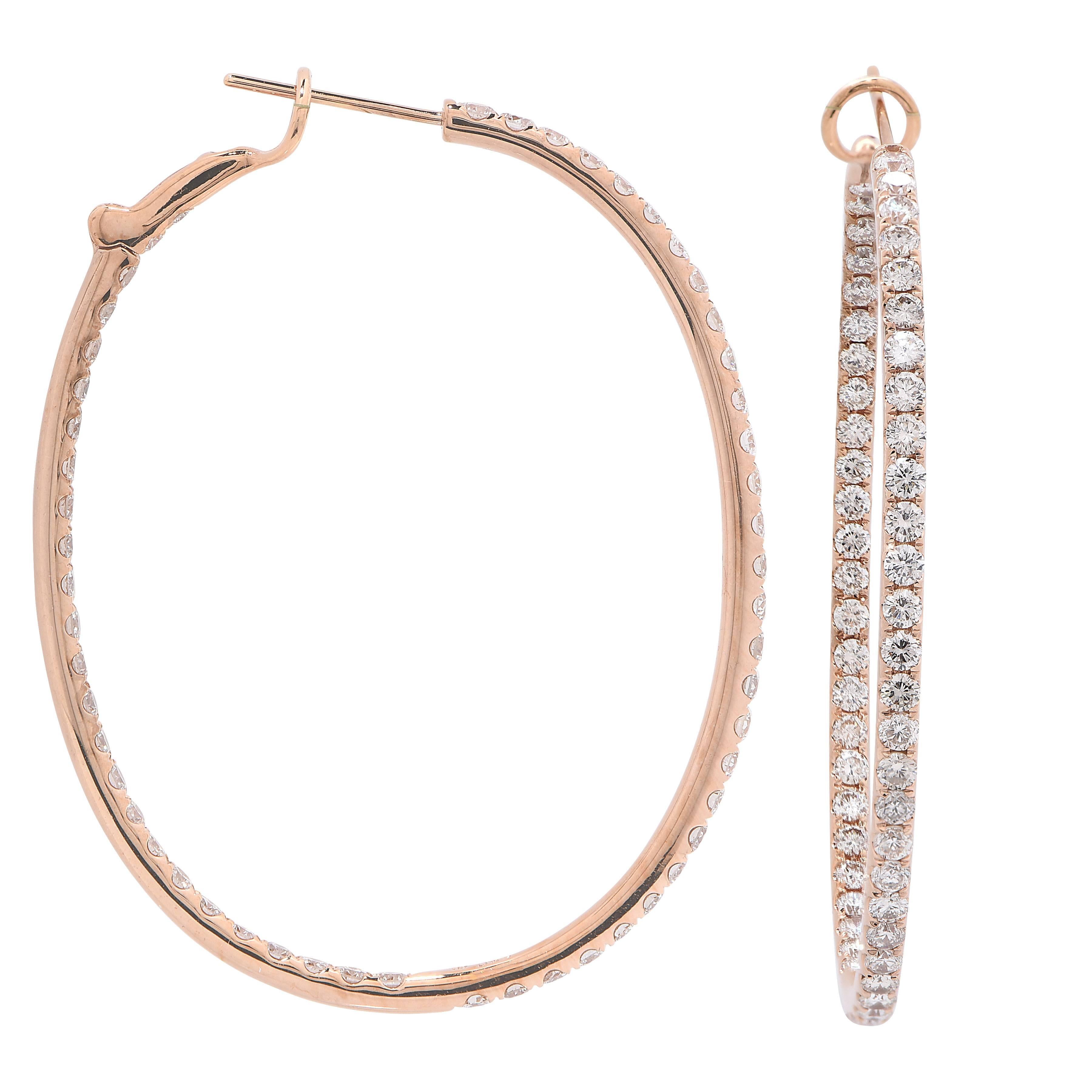 Large Diamond Hoops featuring 108 round brilliant cut diamonds with an estimated total weight of 4 carats set in 18 KT Rose Gold.

Dimensions: 1.75 inches Tall
Metal Type: 18 Kt Rose Gold
Metal Weight: 12.4 Grams