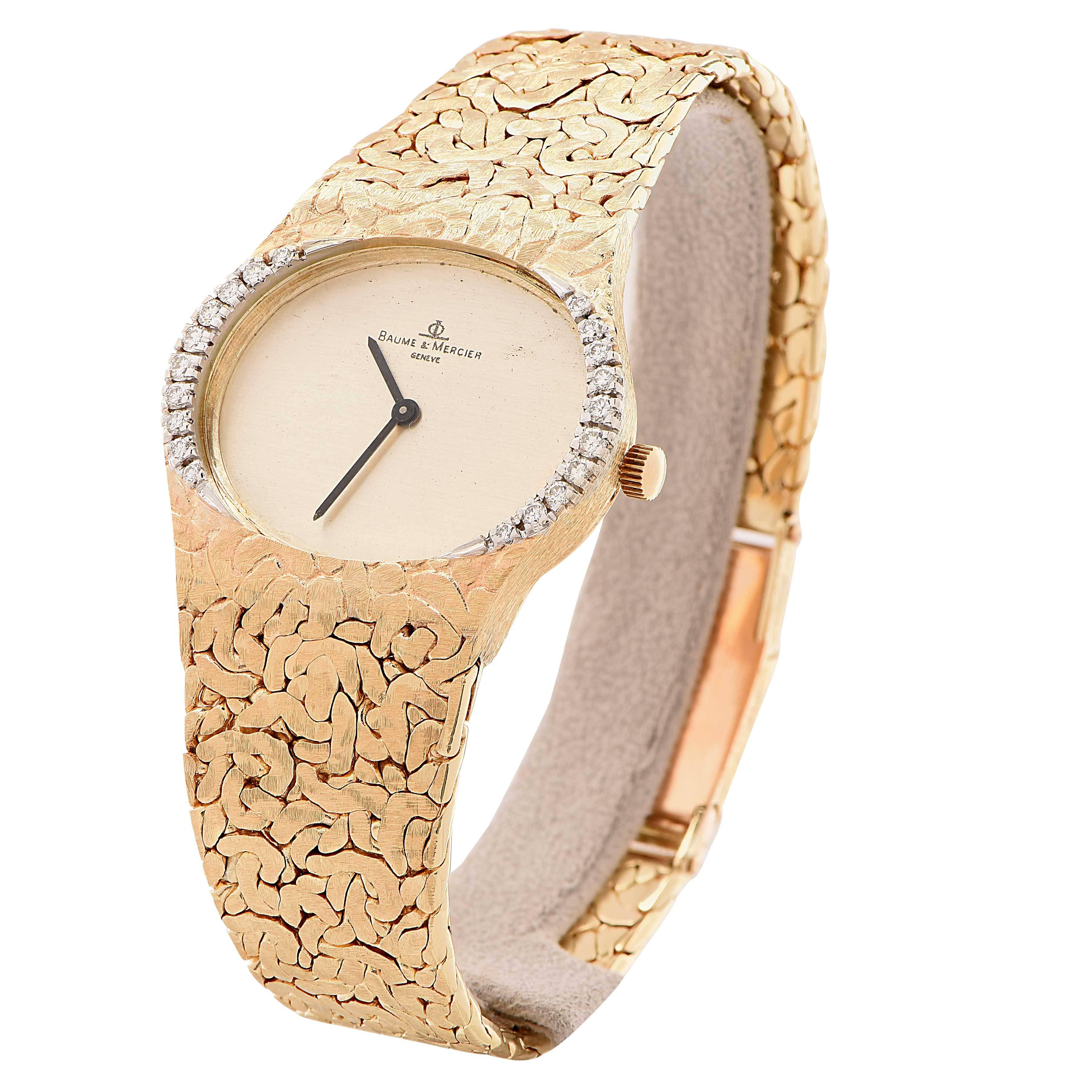 Striking Gents Diamond And Gold Nugget Baume & Mercier watch. 

Metal Type: 14 Kt Yellow Gold
Metal Weight: 91.6 grams
