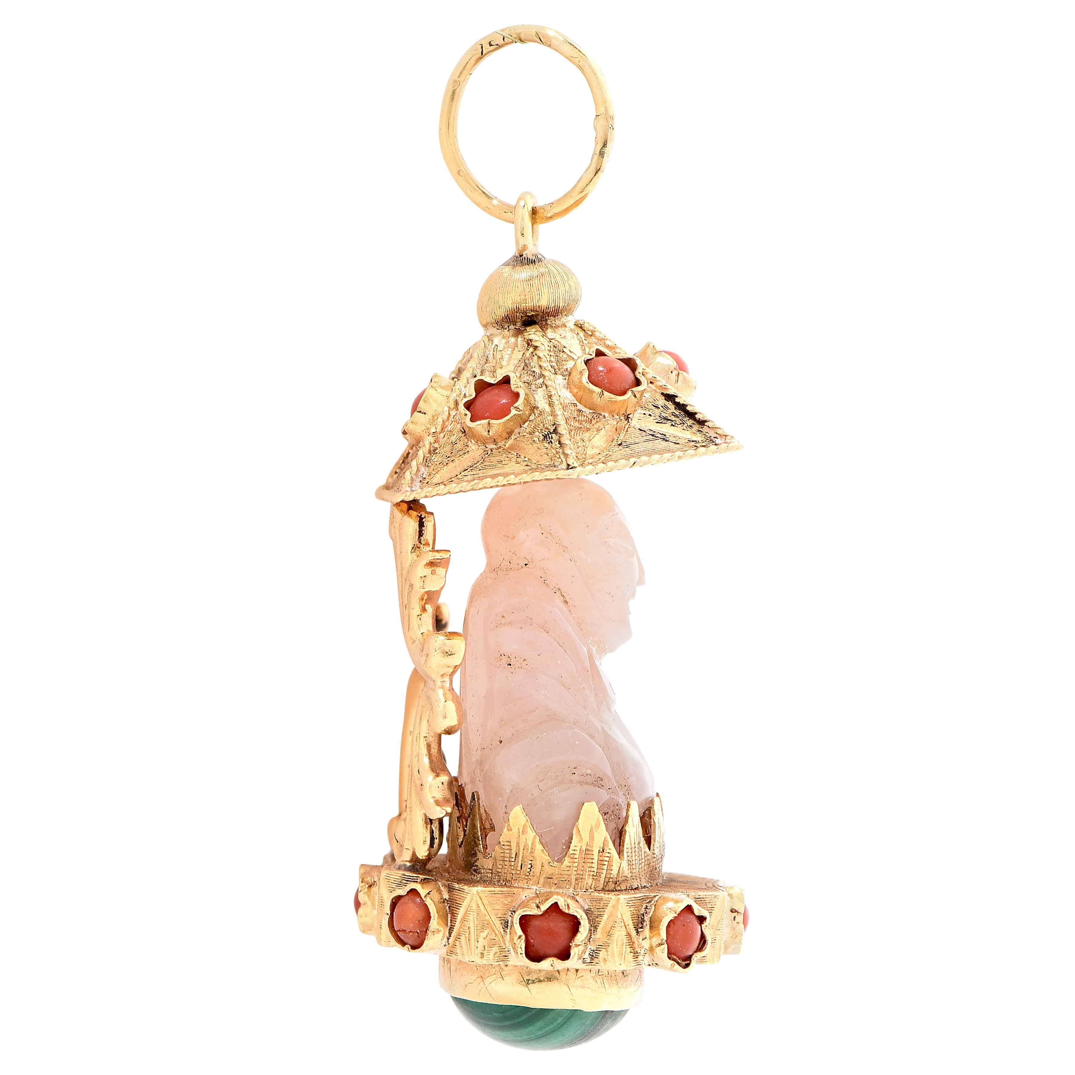 Pink jade Buddha pendant with coral beads and malachite cabochon bottom.