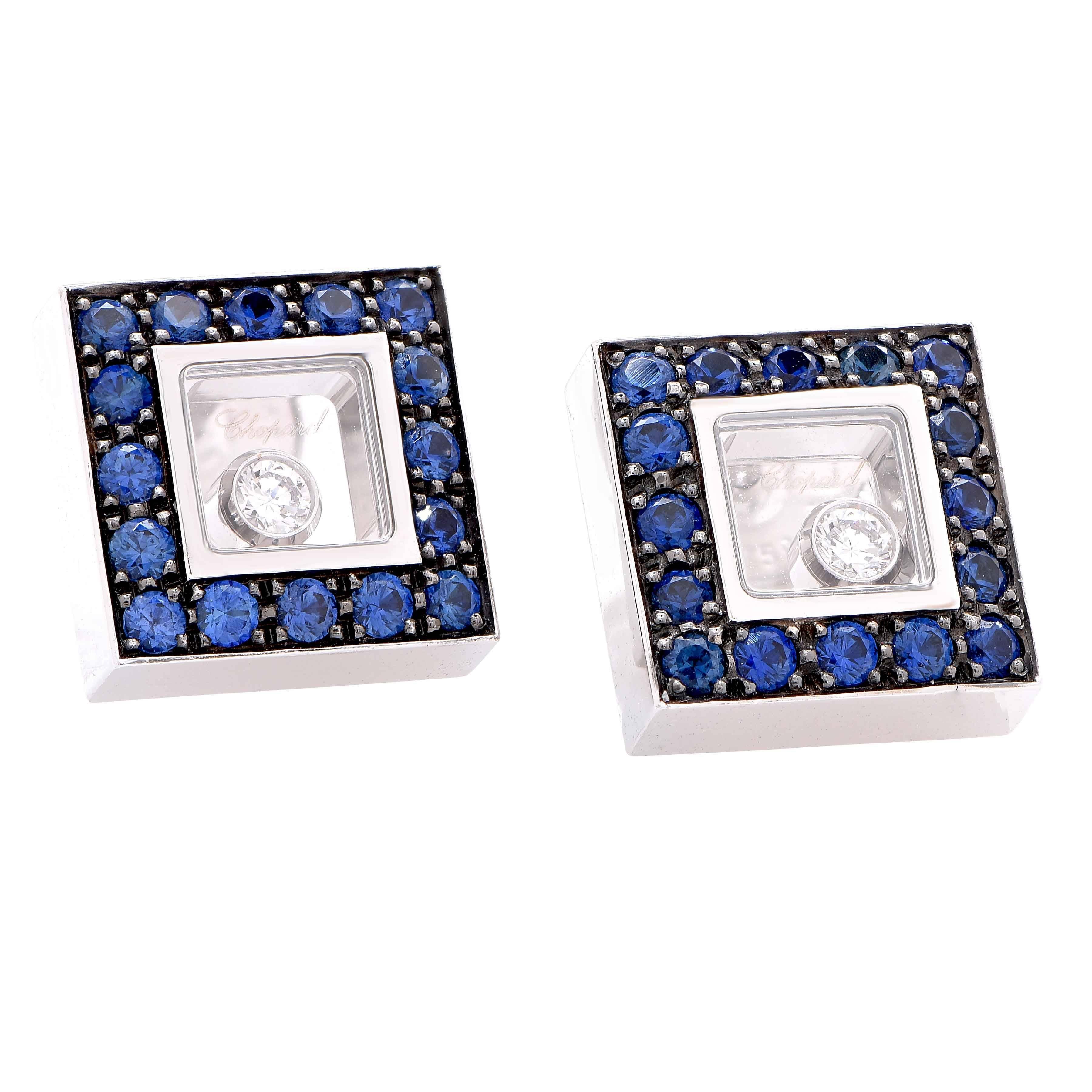 Chopard Happy Diamonds Sapphire and diamonds square 18 karat white gold earrings featuring 32 round cut sapphires with a total weight of .69 carat and two floating diamonds with a total weight of .11 carat. New in box with papers.

Retail price: