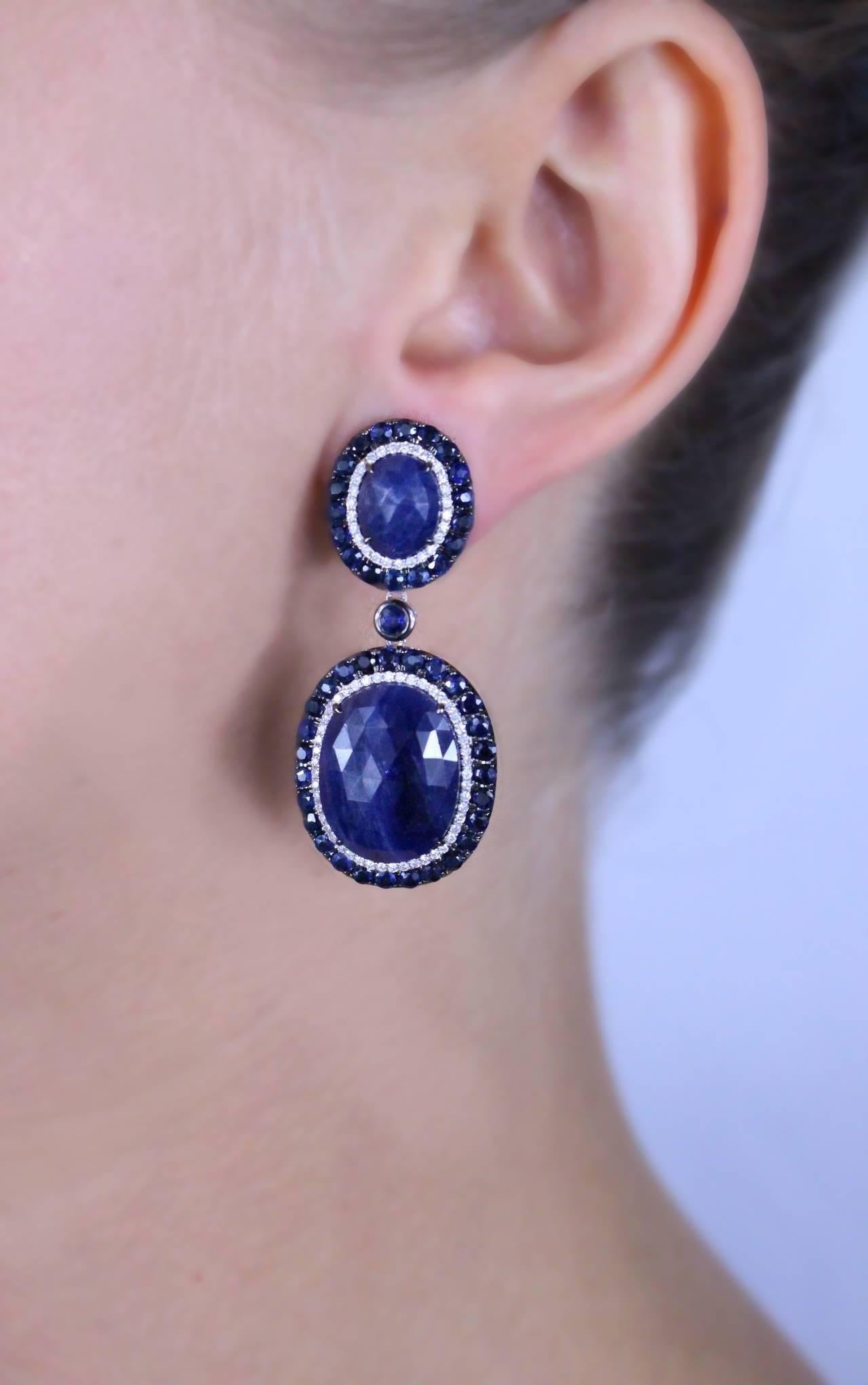 Sapphire and Diamond Earrings featuring 96 mix cut blue sapphires with a total weight of 34.6 carats and 150 single cut diamonds with a total weight of .75 carats.

Metal Type: 18 Kt White Gold 
Metal Weight: 19.8 Grams
