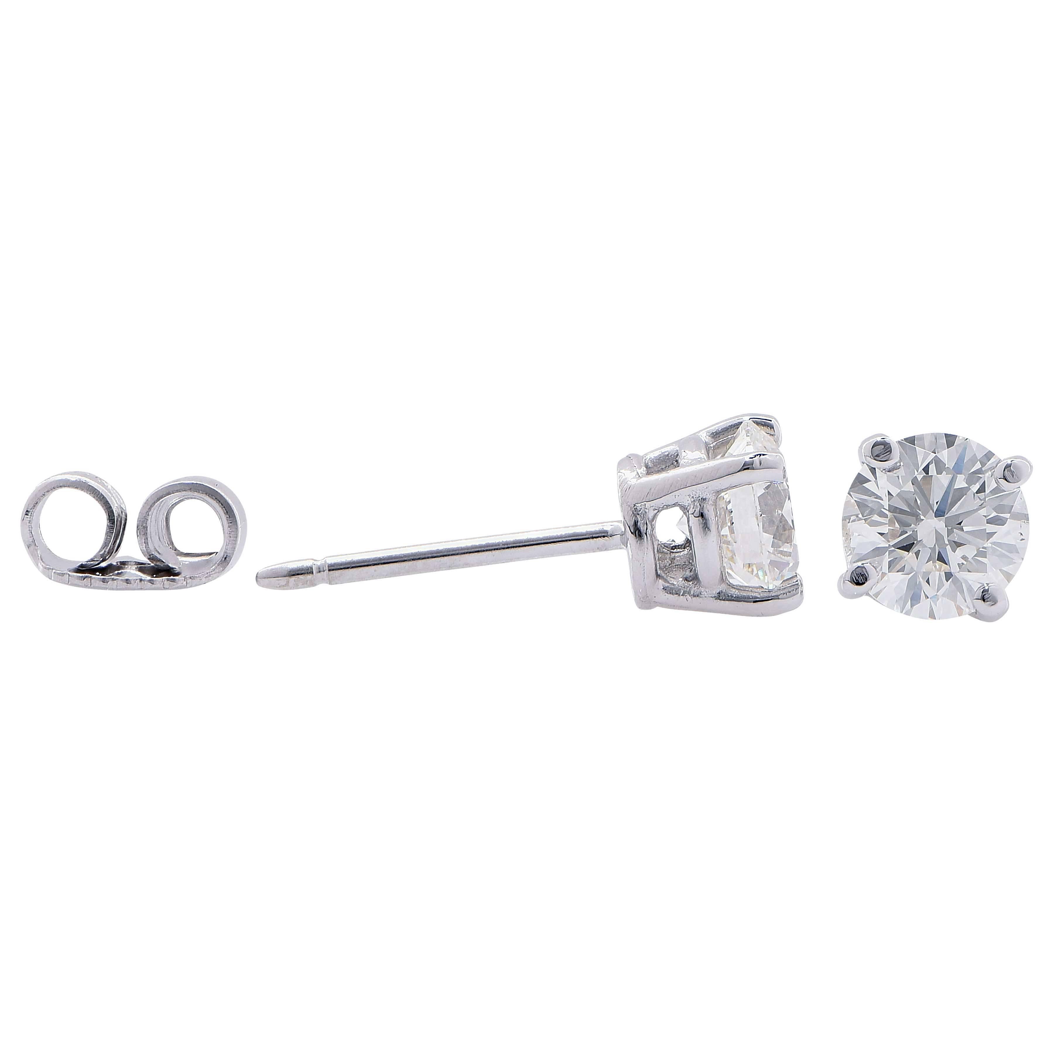 1.4 carat total weight diamond studs featuring two round brilliant cut diamonds with a total weight of 1.40 carats I/J Color VS2/SI1 Clarity set in 18 Karat White Gold.

Metal Type: 18 Karat White Gold, Stamped and Tested
Metal Weight: 2.6 Grams

