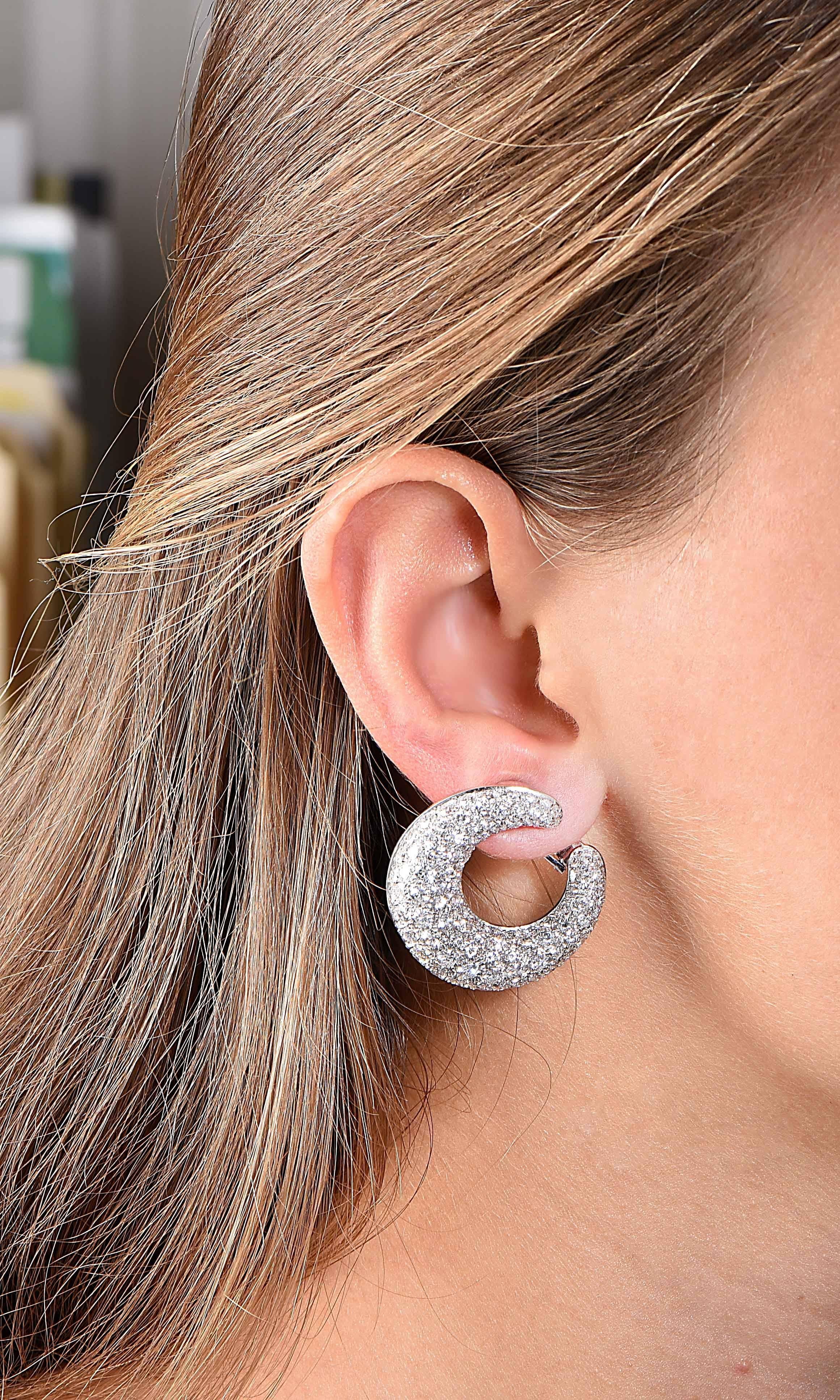 These lively bombe' crescent forms are pave set with 224 diamonds weighing approximately 13.5 carats E/F Color VS Clarity in total mounted in 18 Karat White Gold.

Metal Type: 18 Karat White Gold Tested and Stamped
Metal Weight: 20.8 Grams