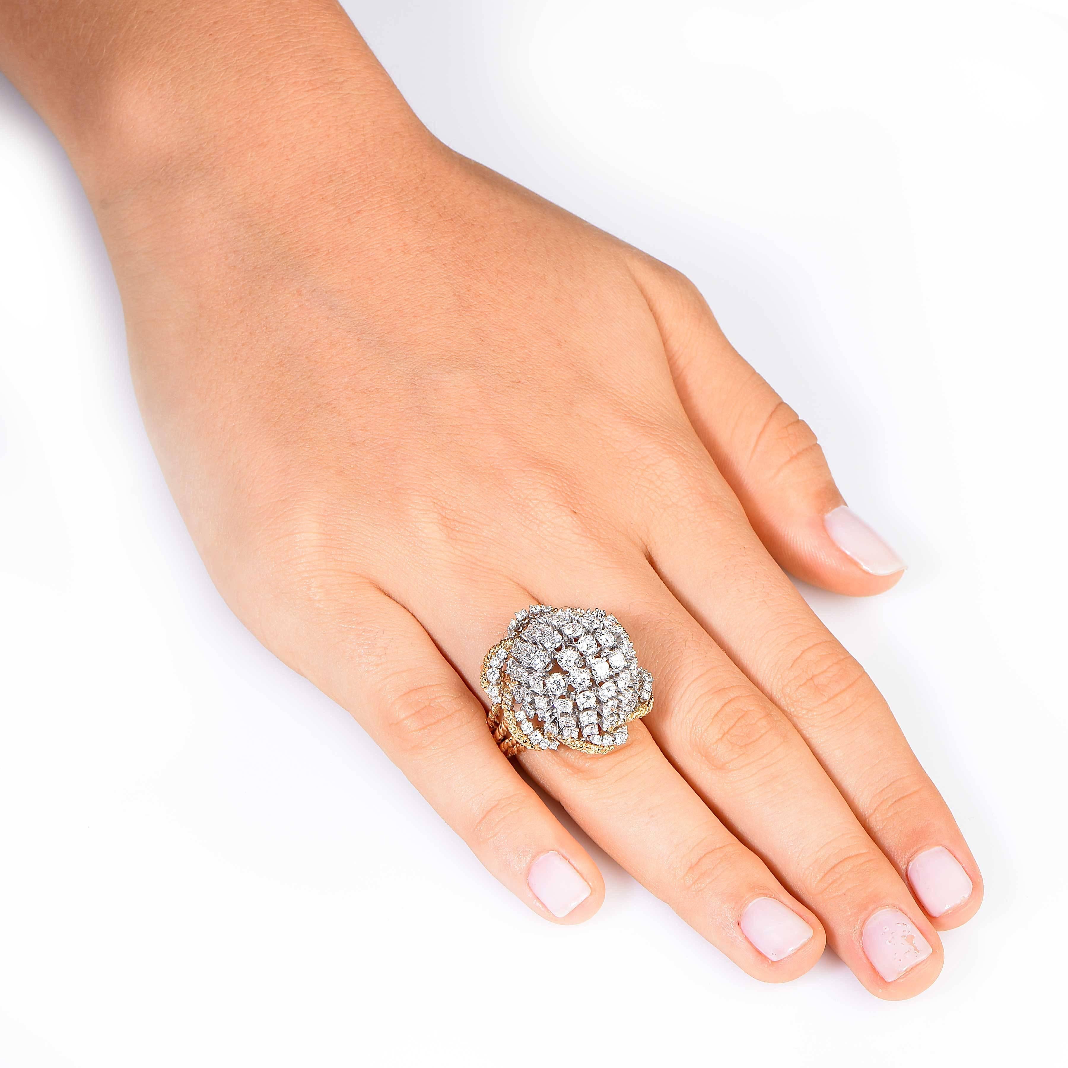 Bombe Style dome ring featuring 90 round brilliant cut diamonds with an estimated total weight of 7.8 carats. The diamonds are prong set in platinum. The body of the ring features a rope design.
Ring Size: 6 3/4

Metal Type: 18 Karat Yellow Gold and