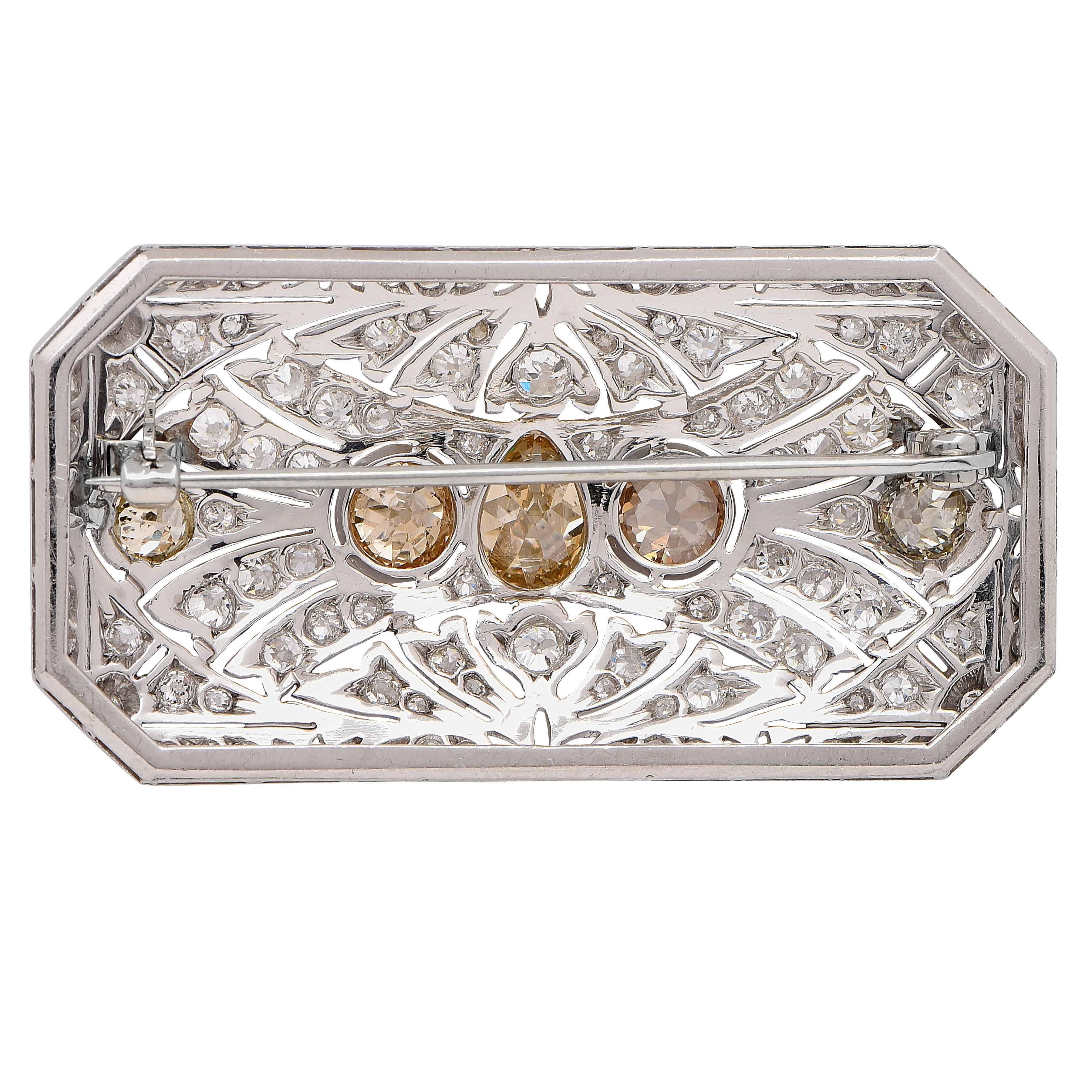 Circa 1925 Art Deco Platinum Brooch featuring 5 fancy colored mix cut diamonds with an estimated total weight of 3.25 carats and 96 mix cut G/H color diamonds with an estimated total weight of 2.65 carats. 

Metal Type: Platinum (tested and/or