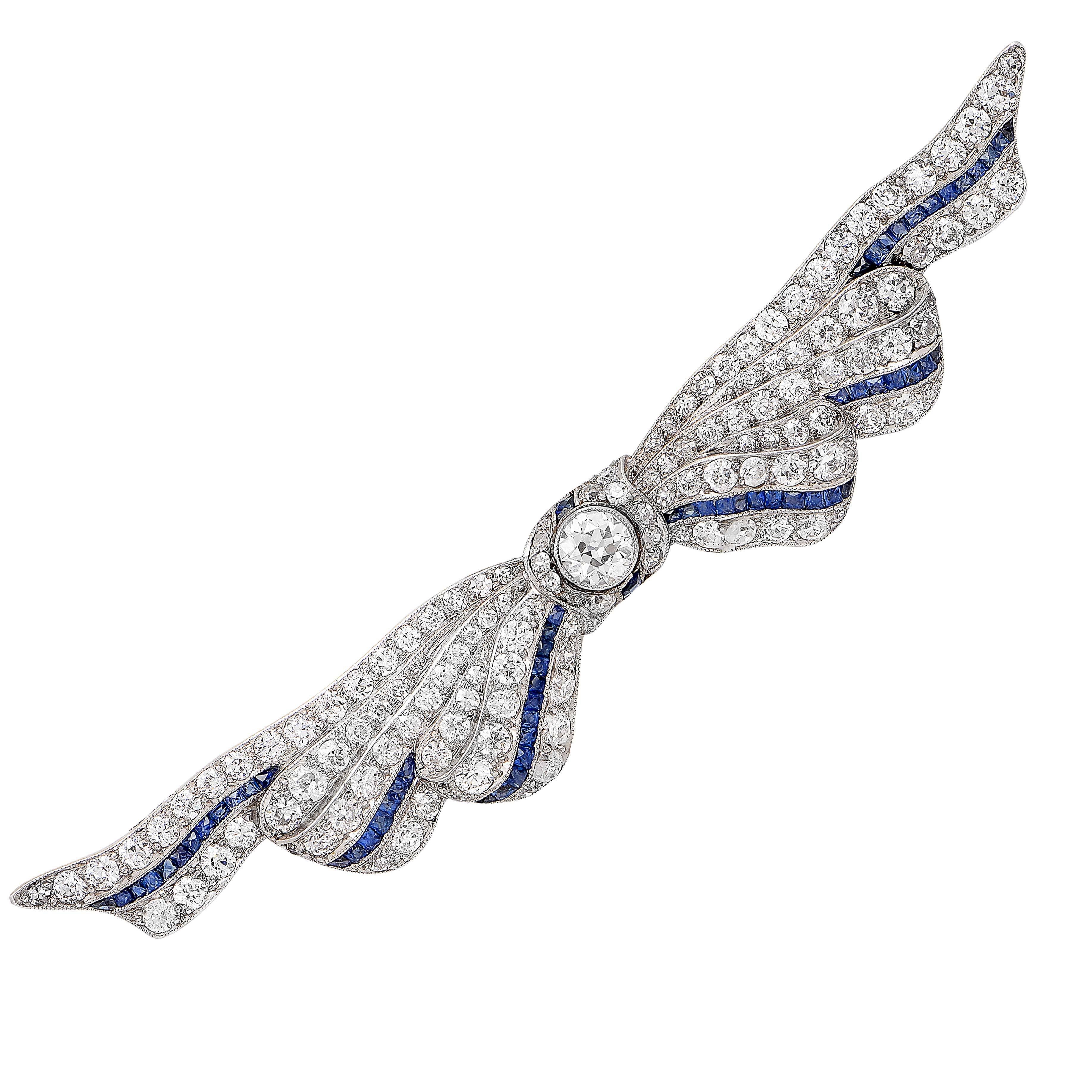 3 Carat Diamond and Sapphire Ribbon Platinum Brooch. Circa 1930