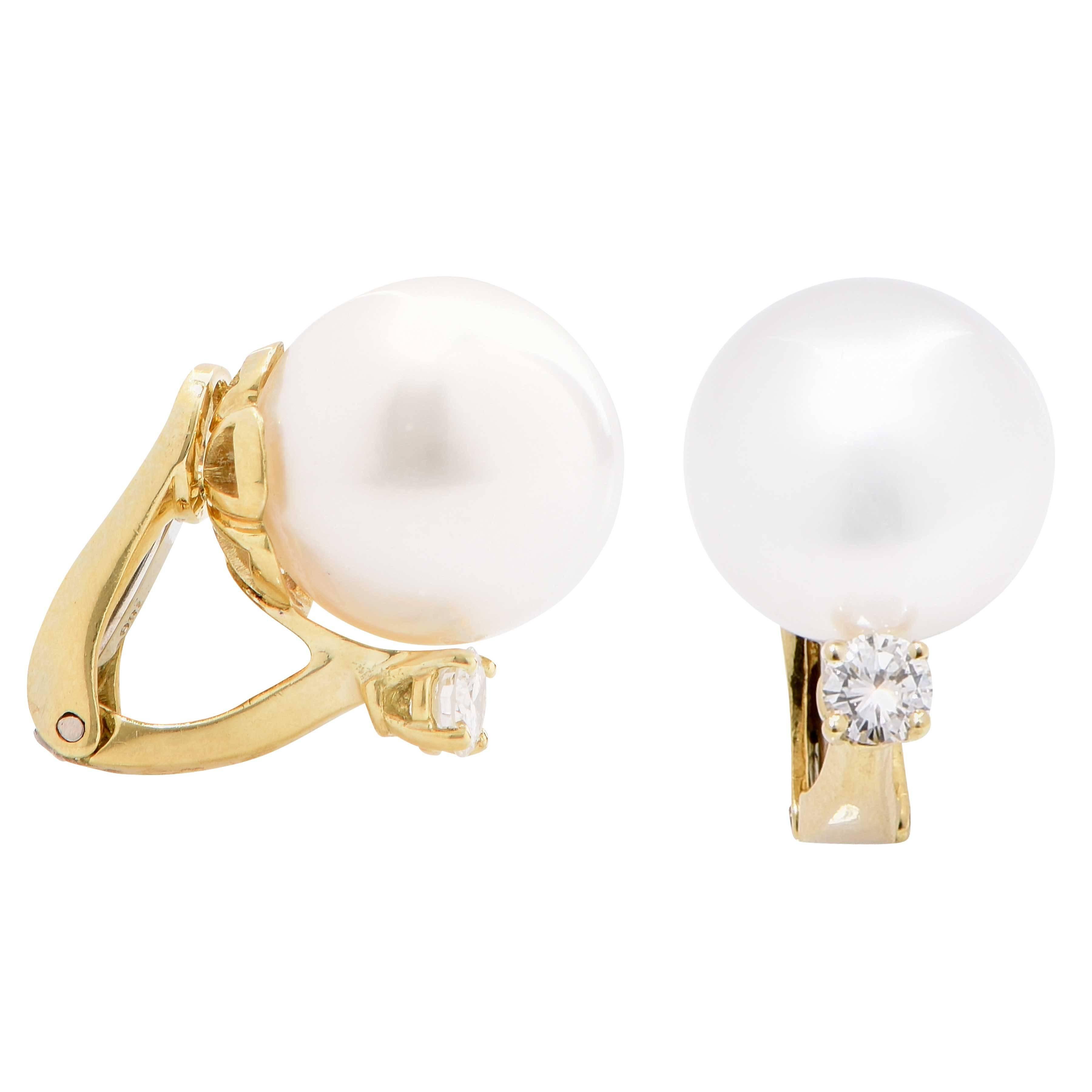 These classic pearl and diamond earrings feature two 12mm pearls as well as two round brilliant cut diamonds with an estimated total weight of .40 carat. 

Metal Type: 18 Kt Yellow Gold (Tested and/or stamped)
