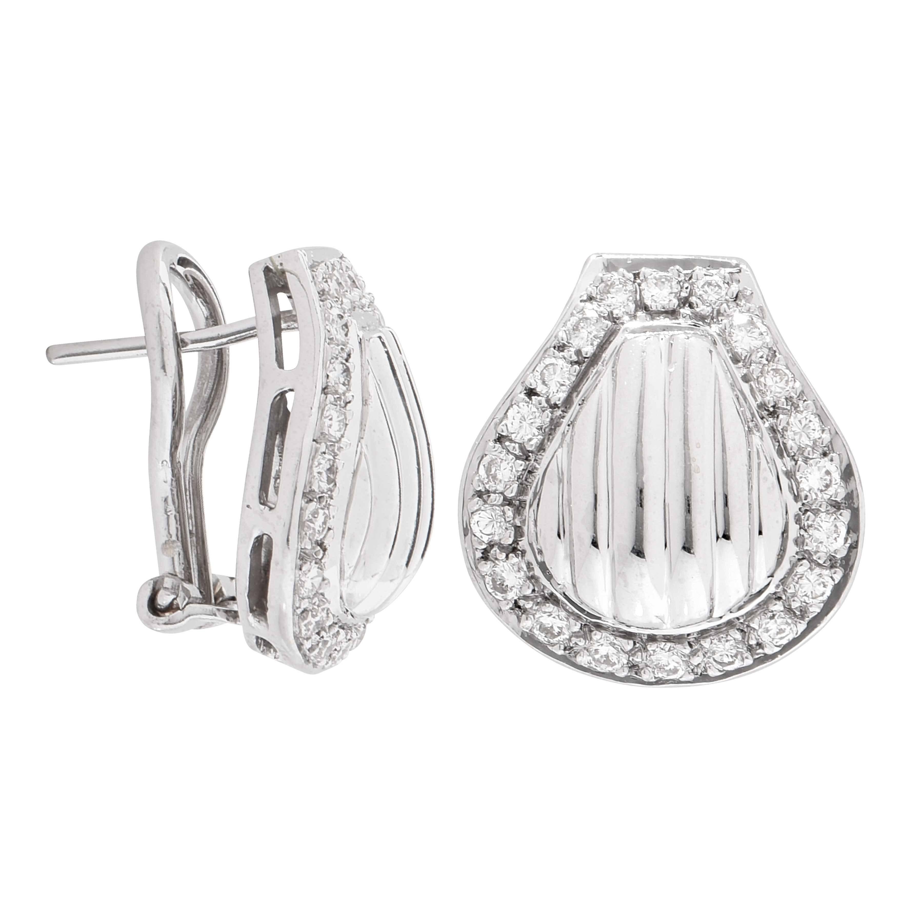 These whimsical clam shell design earrings feature 40 bead set round cut diamonds with an estimated total weight of .80 carars. 

Metal Type: 18 Karat White Gold (tested and/or stamped)
Metal Weight: 8.7 Grams

