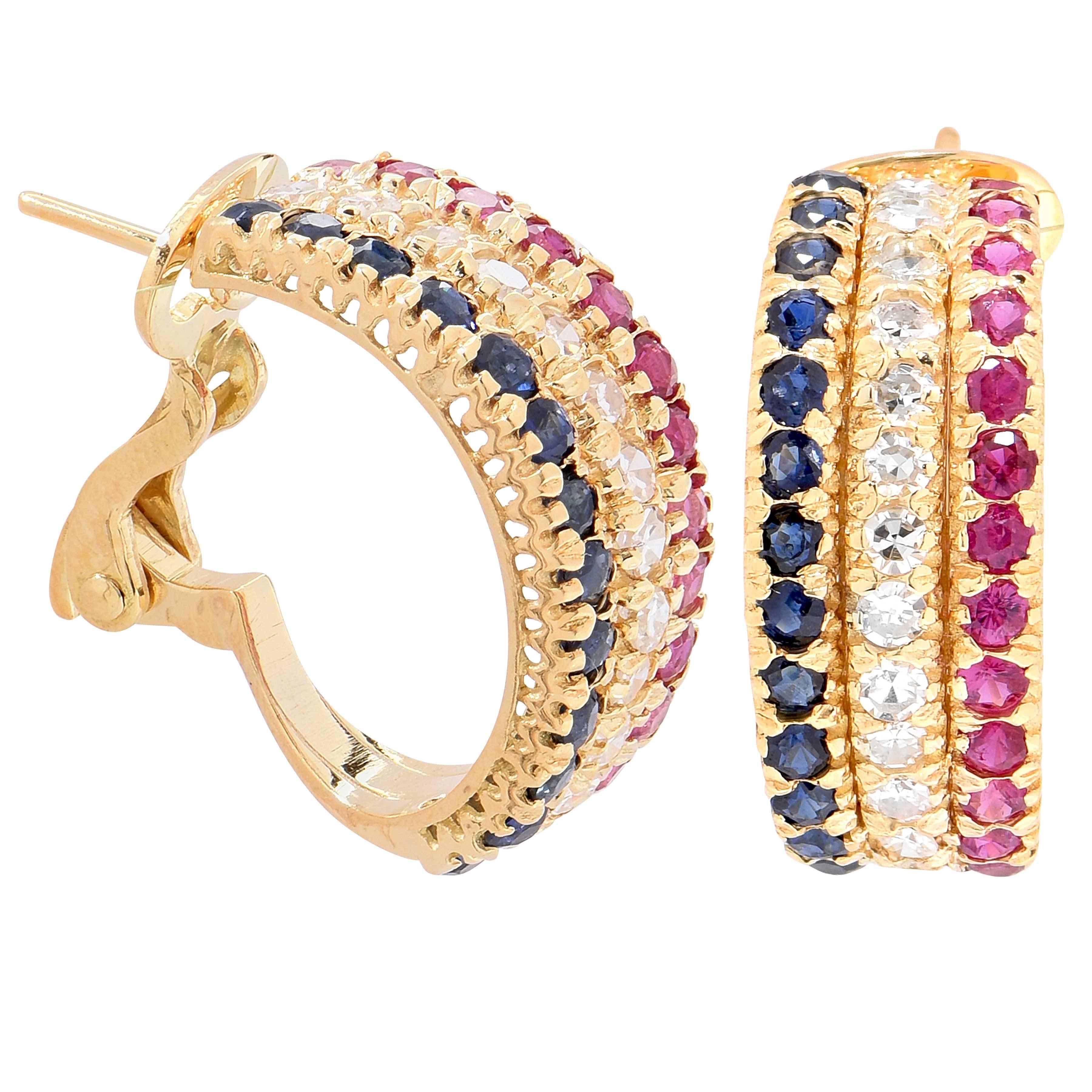 These lively three row earrings feature natural sapphires, rubies and diamonds bead set into 14 karat yellow gold clips with posts.