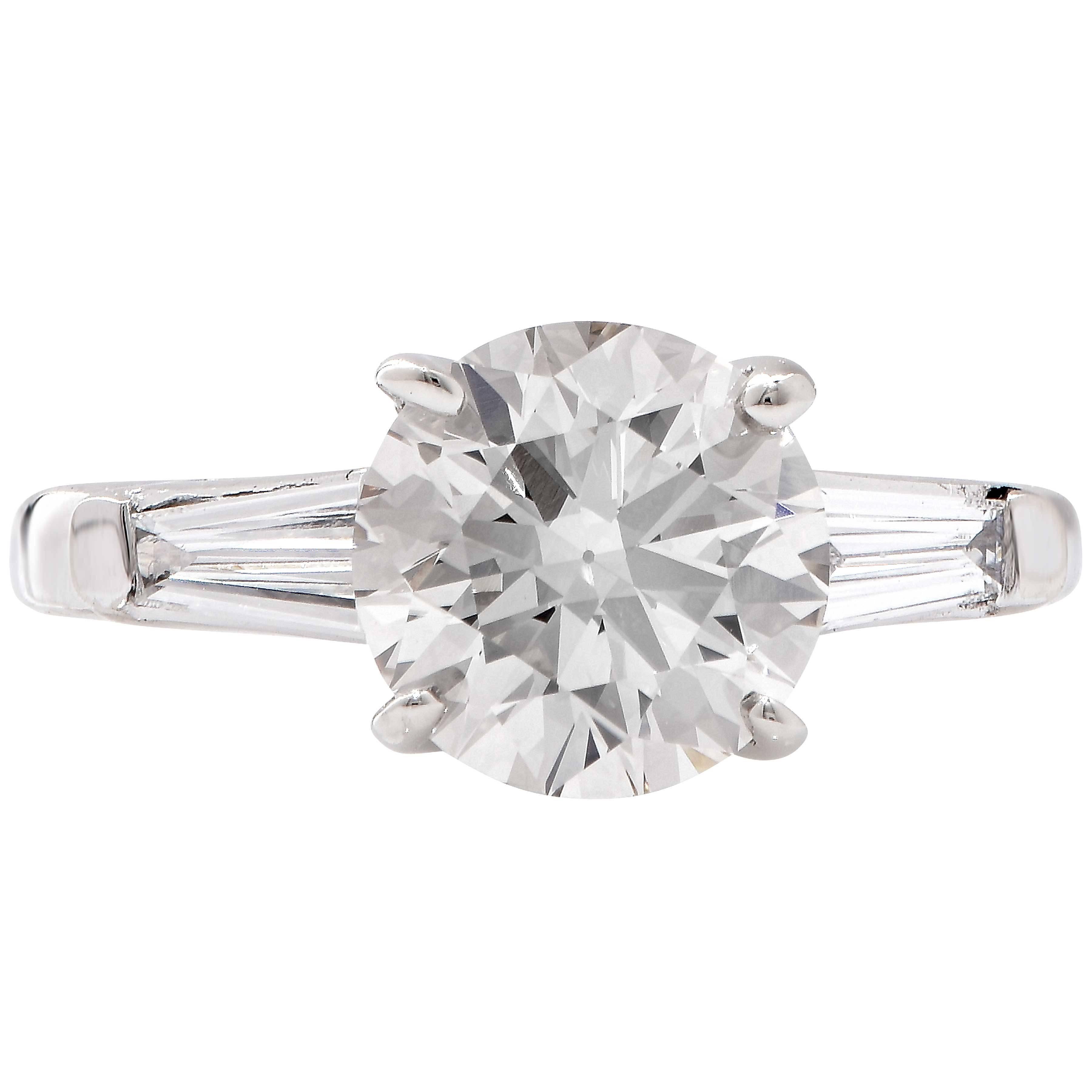 GIA Graded 2.14 Carat M/ VS1 Round Brilliant Cut Diamond engagement ring with two tapered baguette cut diamonds with an estimated total weight of .30 carats.
Ring Size; 4 1/7
Metal Type: 14 Kt White Gold
Metal Weight: 4 Grams