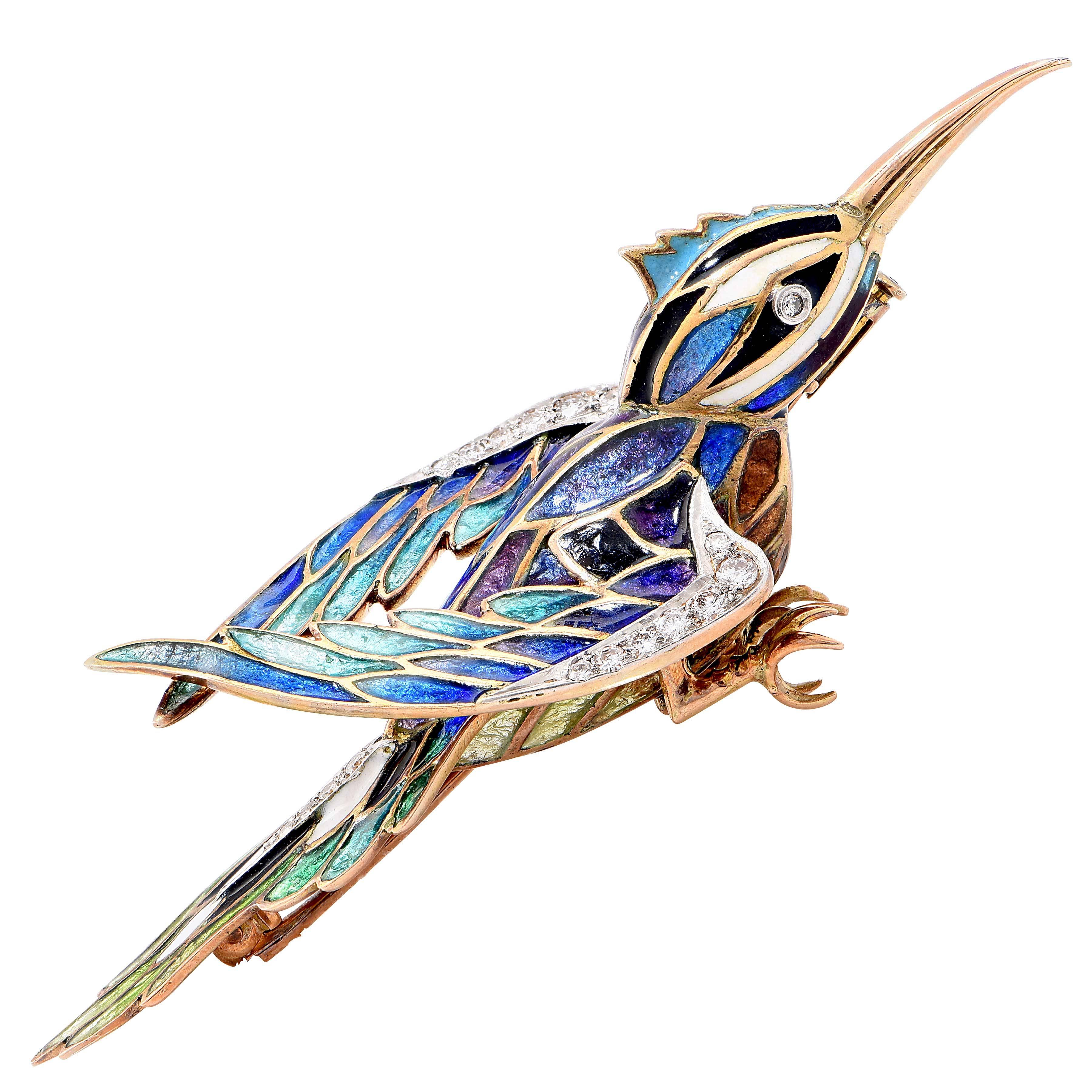 Hummingbird brooch in multiple colors of enamel, set with 20 single and full cut diamonds.

Metal Type: 18 Karat Yellow Gold (tested and/or stamped)
Metal Weight: 26.8 Grams