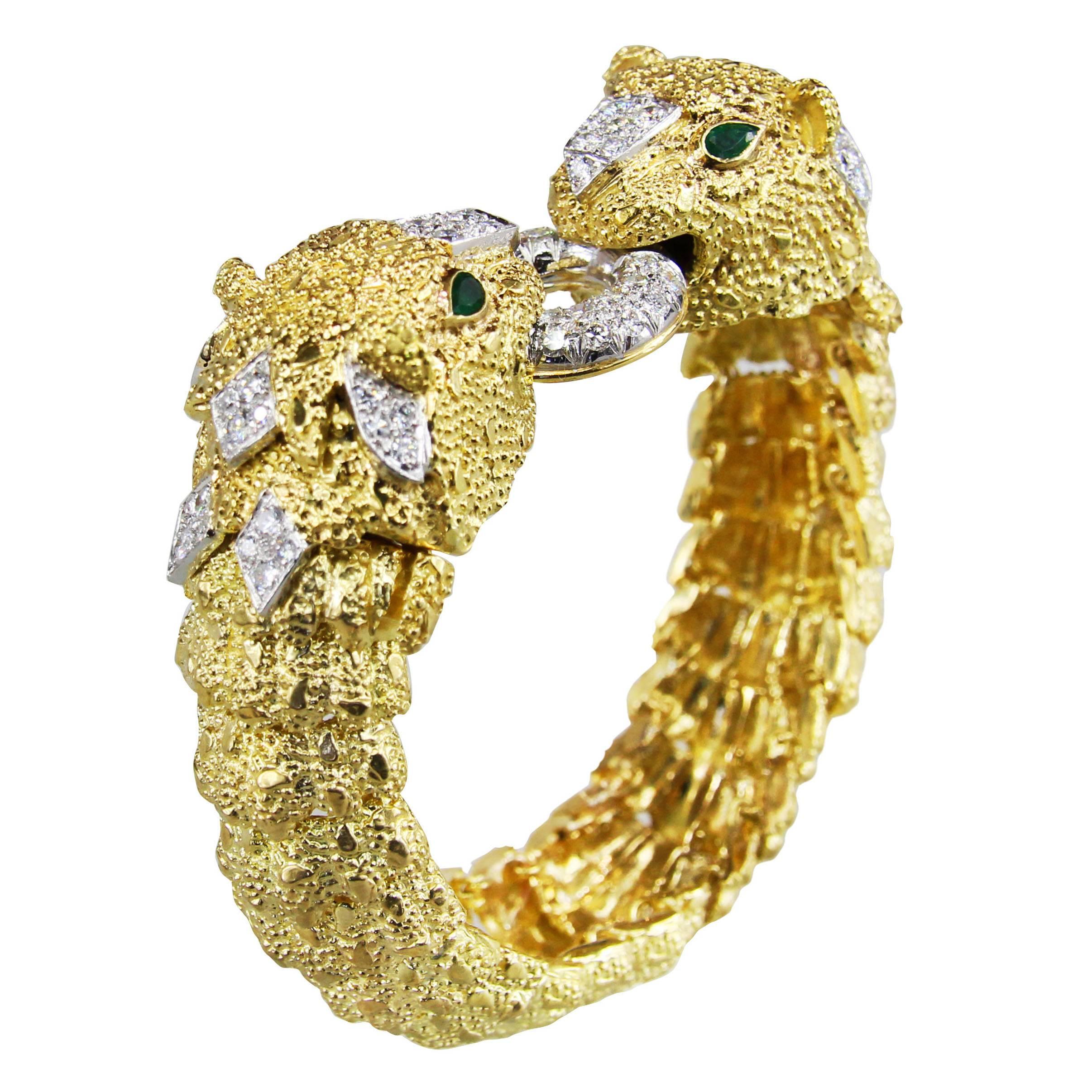 Gold and diamond bracelet with textured links, and an interchangeable faceted emerald bead section consisting of 9 strands. The panther heads have round diamonds weighing approximately 2.50 carats. The inner bracelet is 6 1/2 inches. 