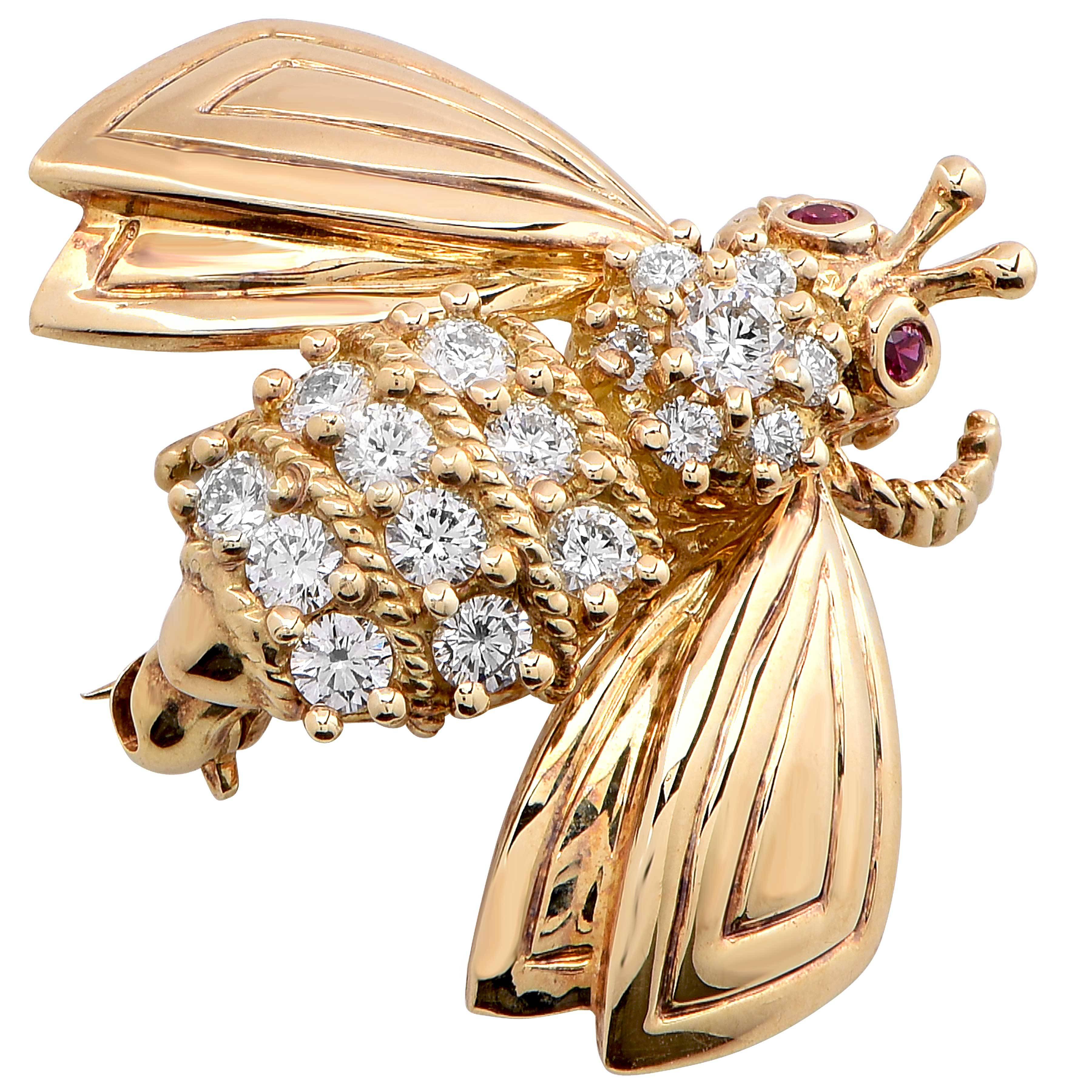 Tiffany & Company 18 karat yellow gold diamond bee brooch. This very lively brooch is set with 17 round brilliant cut diamonds which weigh approximately 0.50 carats and 2 round rubies as the eyes.

Metal Type: 18kt Yellow Gold
Metal Weight: 7.2 grams