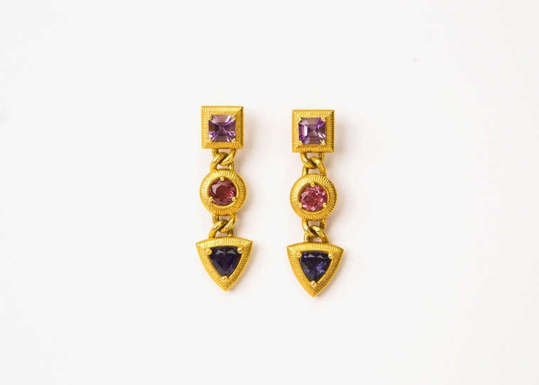 Paul Morelli's use of simple shapes and detailed finishes creates perfect frames for amethyst, tourmaline and tanzanite.  1 3/4 inches of wearable style.