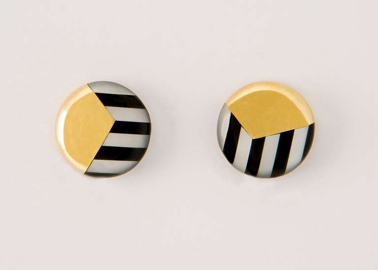 Playful stripes of black onyx and mother of pearl make this Tiffany earring easy to wear.  3/4 of an inch in size.
