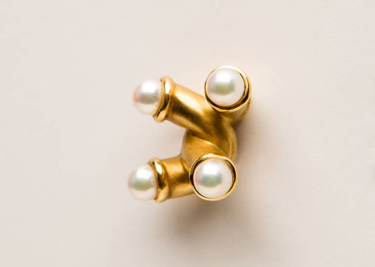 These are not grandma's pearl earrings!  Wearable modern shapes accented with beautiful cultured pearls.  Angela Cummings at her best.  Approximately 1 inch in size.