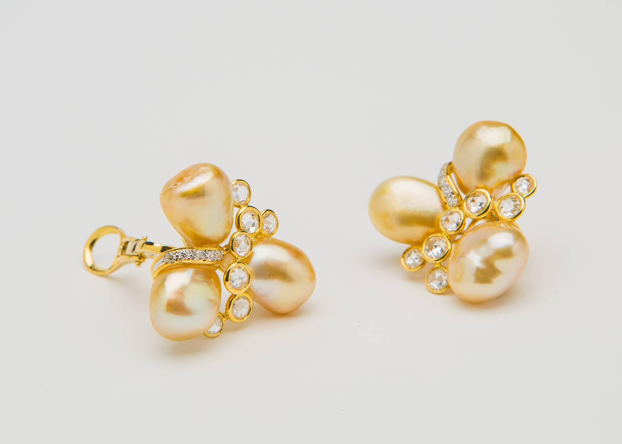 Rich golden Keshi pearls from the South Seas are accented with brilliant cut and unique rose cut diamonds all set in handmade mountings designed by legendary pearl company Assael. Just over 1 inch in size.
