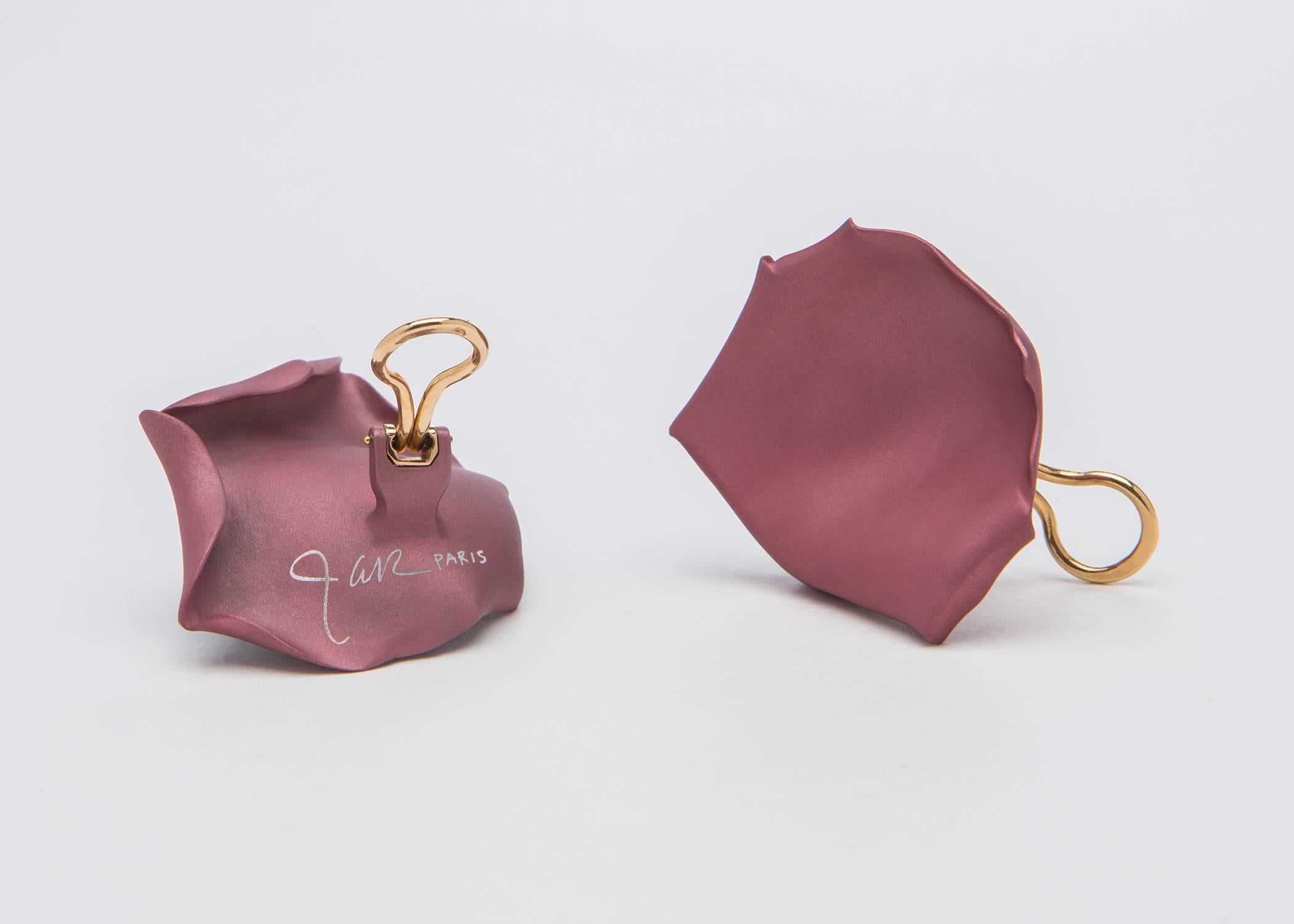 The only living jewelry designer to be honored at the Metropolitan Museum of Art. JAR ( Joel Arthur Rosenthal ) creates wearable sculpture with the simple shape of a rose petal. Rare and collectable. Original suede pouch, never worn. Approximately 1