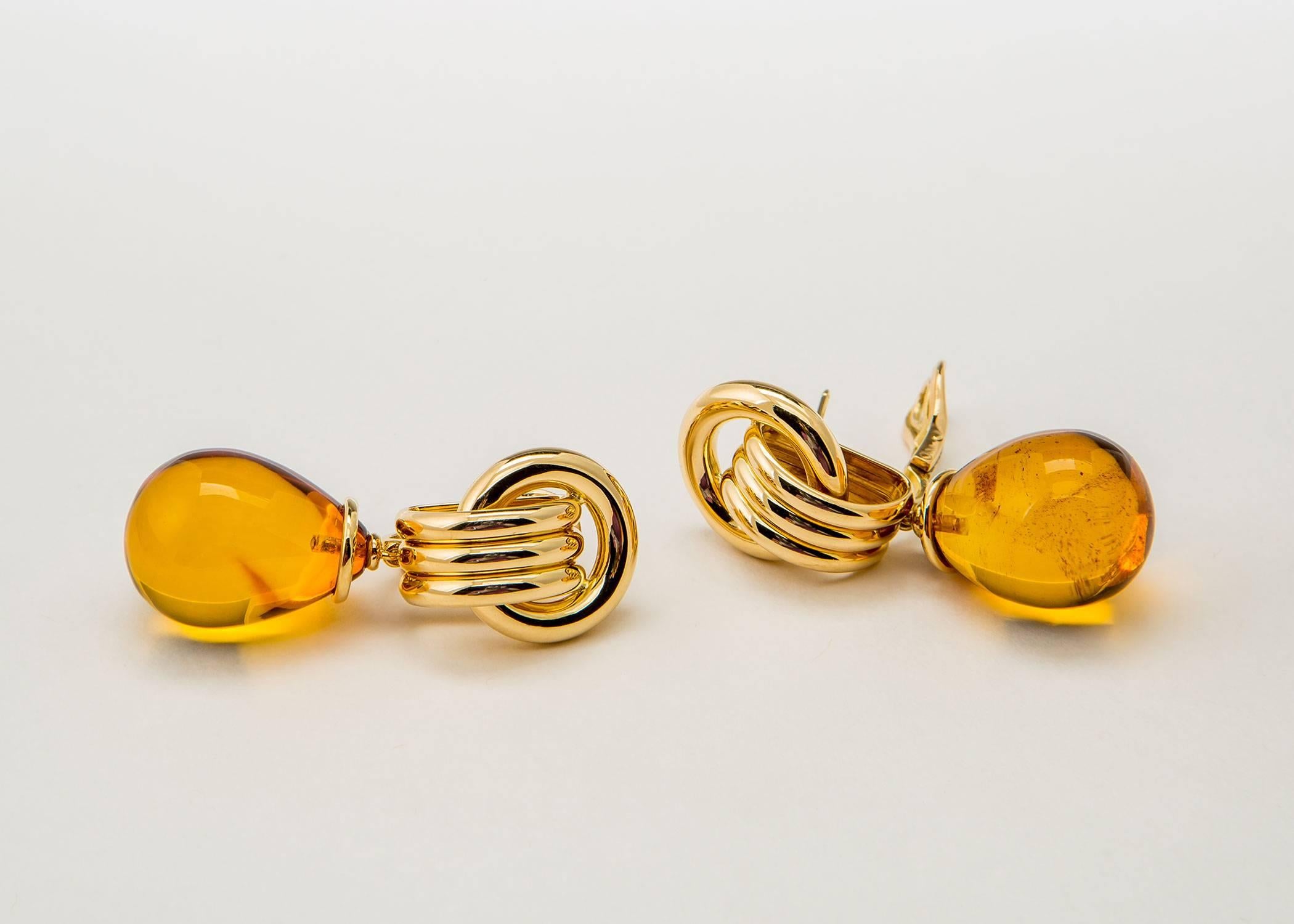 The excellence of Abel and Zimmerman !!! A classic geometric top is created with rich 18k gold to suspend a dramatic pair of amber drops. Simply Chic.            1 7/8's inches in length 