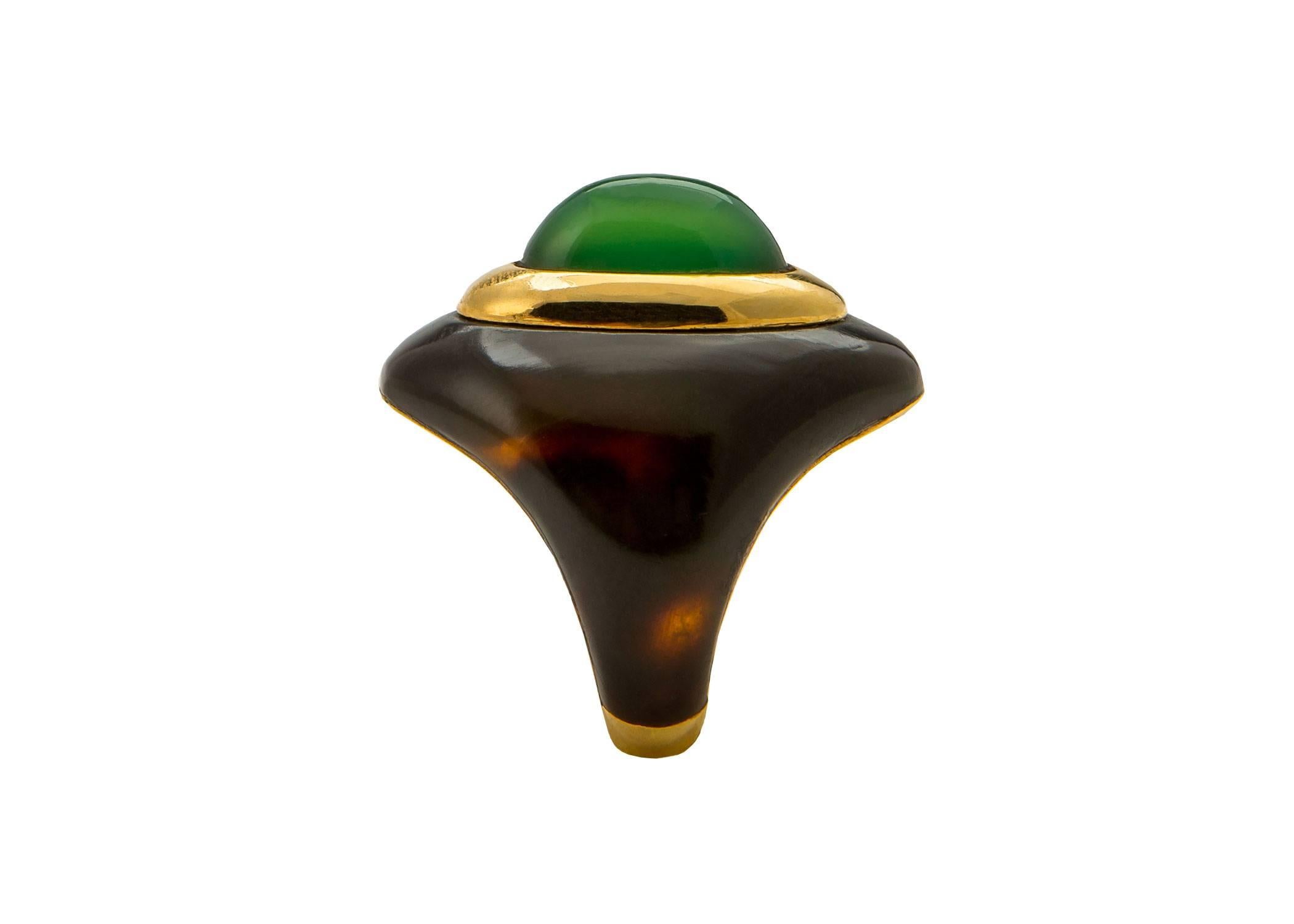 A rare opportunity. This Boucheron Paris ring with maker's mark and French assay mark could not be made today. A lush combination of rich translucent tortoise shell and vivid green chrysoprase create a chic statement piece. Approximately 1 1/8