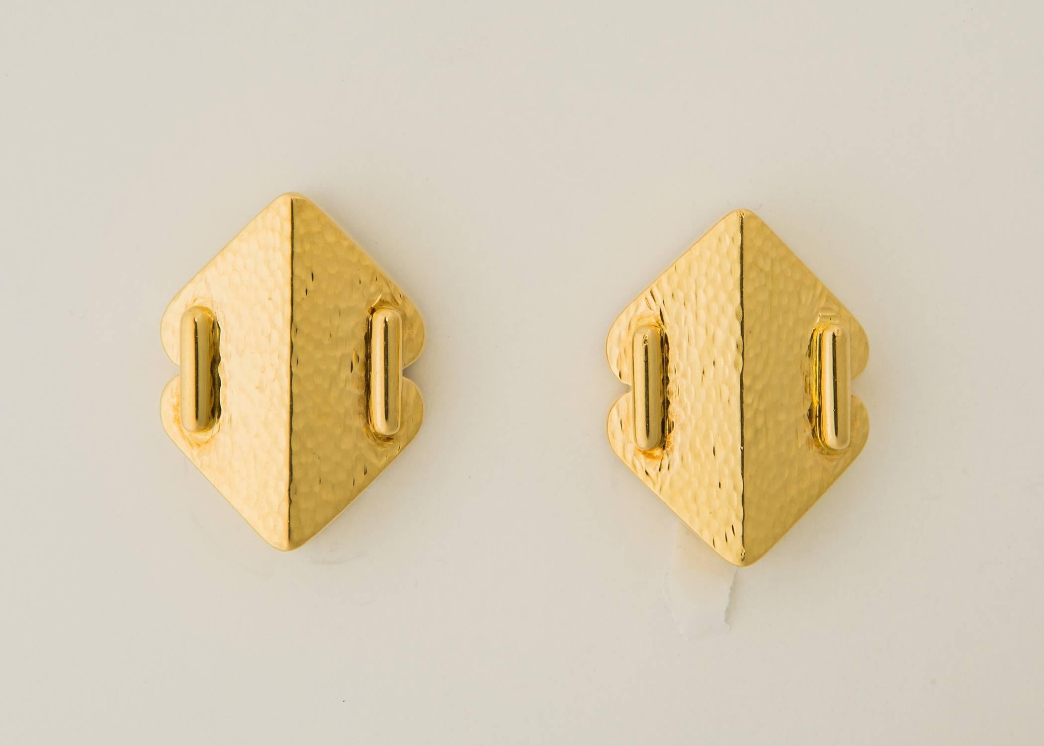 Andrew Clunn's long time association with David Webb shows through in this pair of classic geometric earrings. beautifully detailed with a pebble finish. 1 1/4 inches in size. 