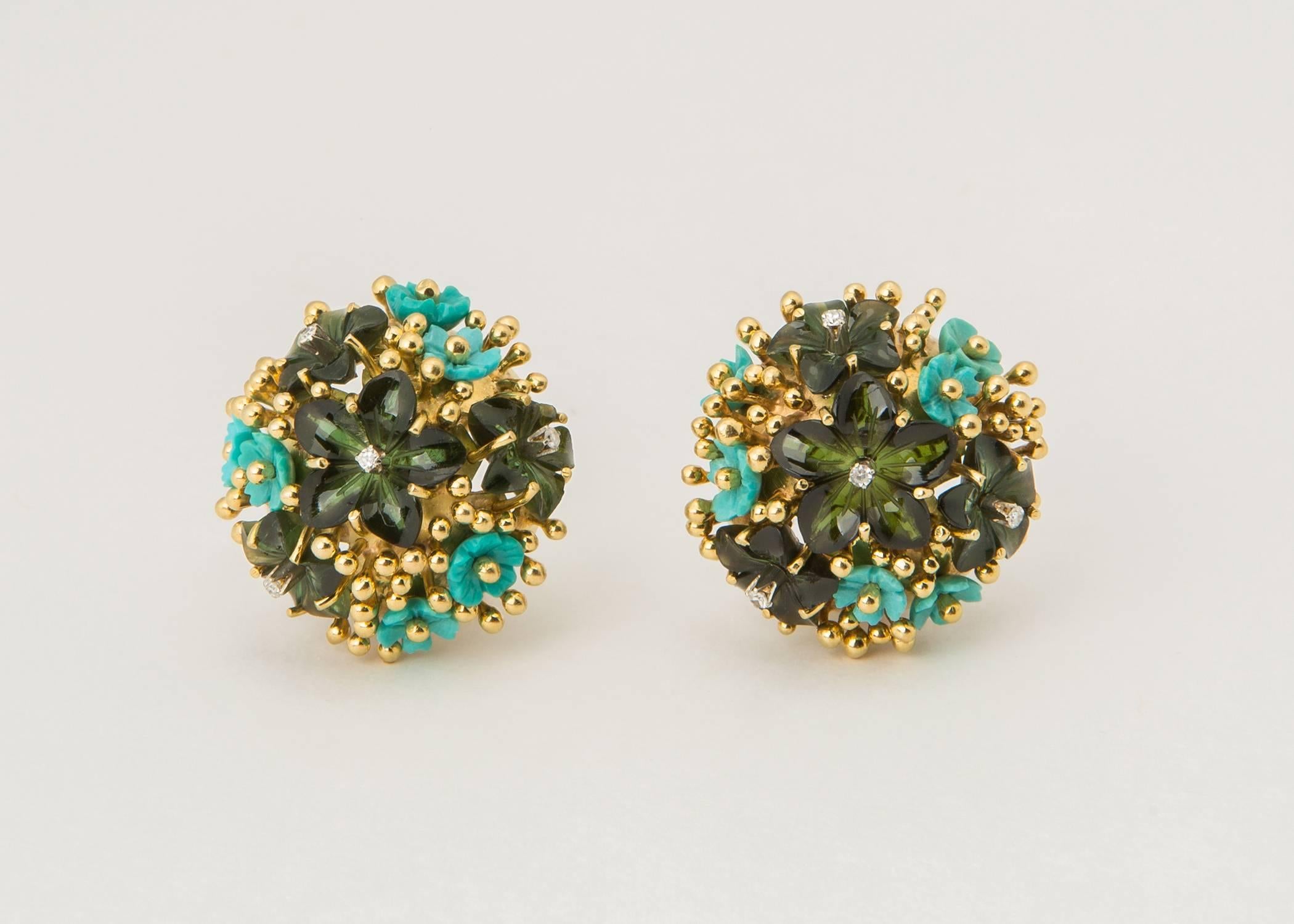 Tiffany & Co. combines carved green tourmaline and turquoise flowers and sets them in a playful field of gold. This is an exceptional example of Tiffany style. Please view second image. 1 inch in size. 