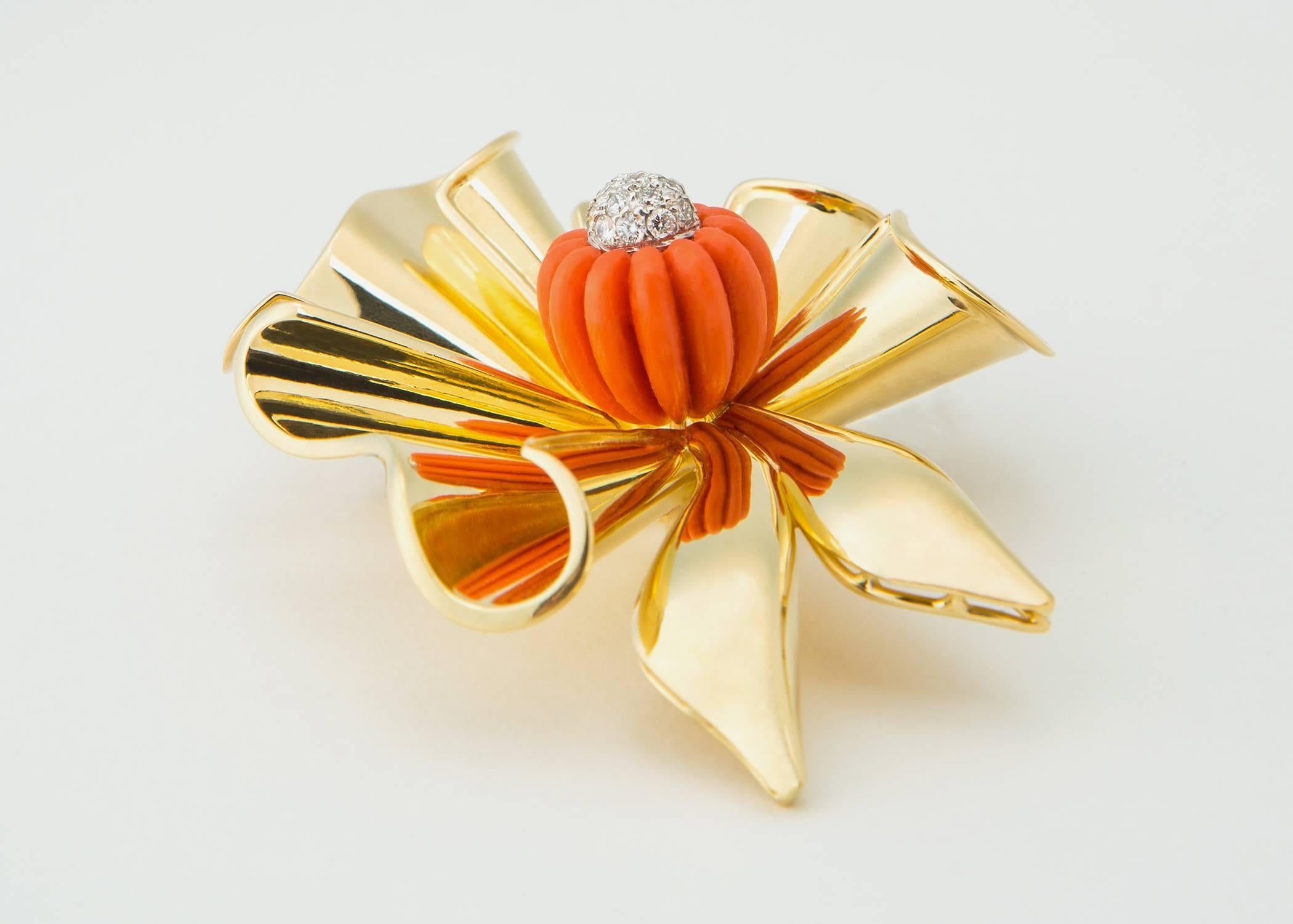 Simply Fabulous !!!  A bold dimensional ribbon is accented with carved coral and finished with brilliant cut diamonds. The deep orange coral measures 13.60mm set inside a 2 1/4 inch ribbon of gleaming 18k gold. Please view second image. 
