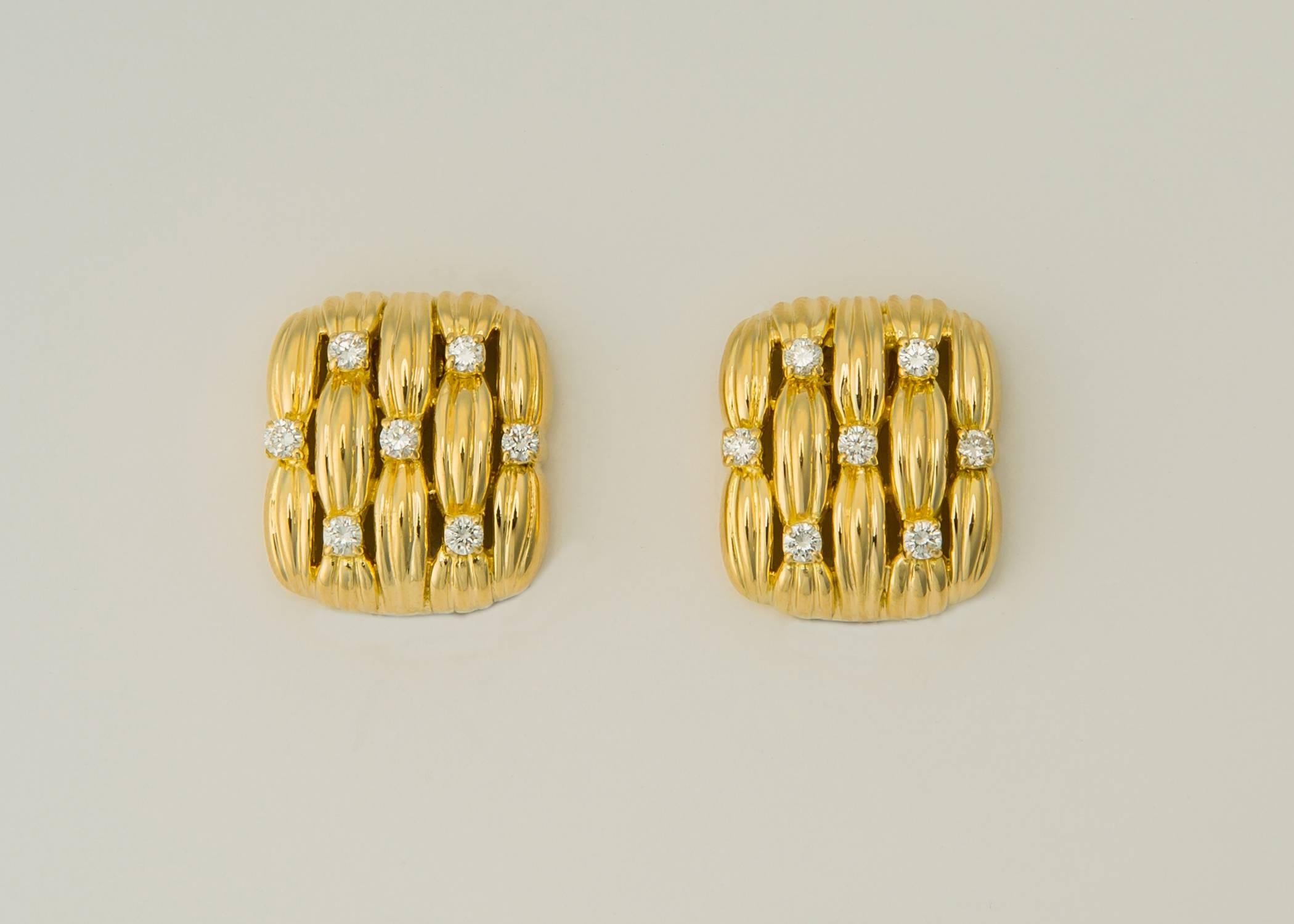 A Tiffany Classic. Woven gold with great detailing is accented with brilliant cut diamonds to create a chic timeless style. 14 diamonds total 1.40 carats. This earring measures 7/8's of an inch vertically and 3/4's of an inch across. Please view