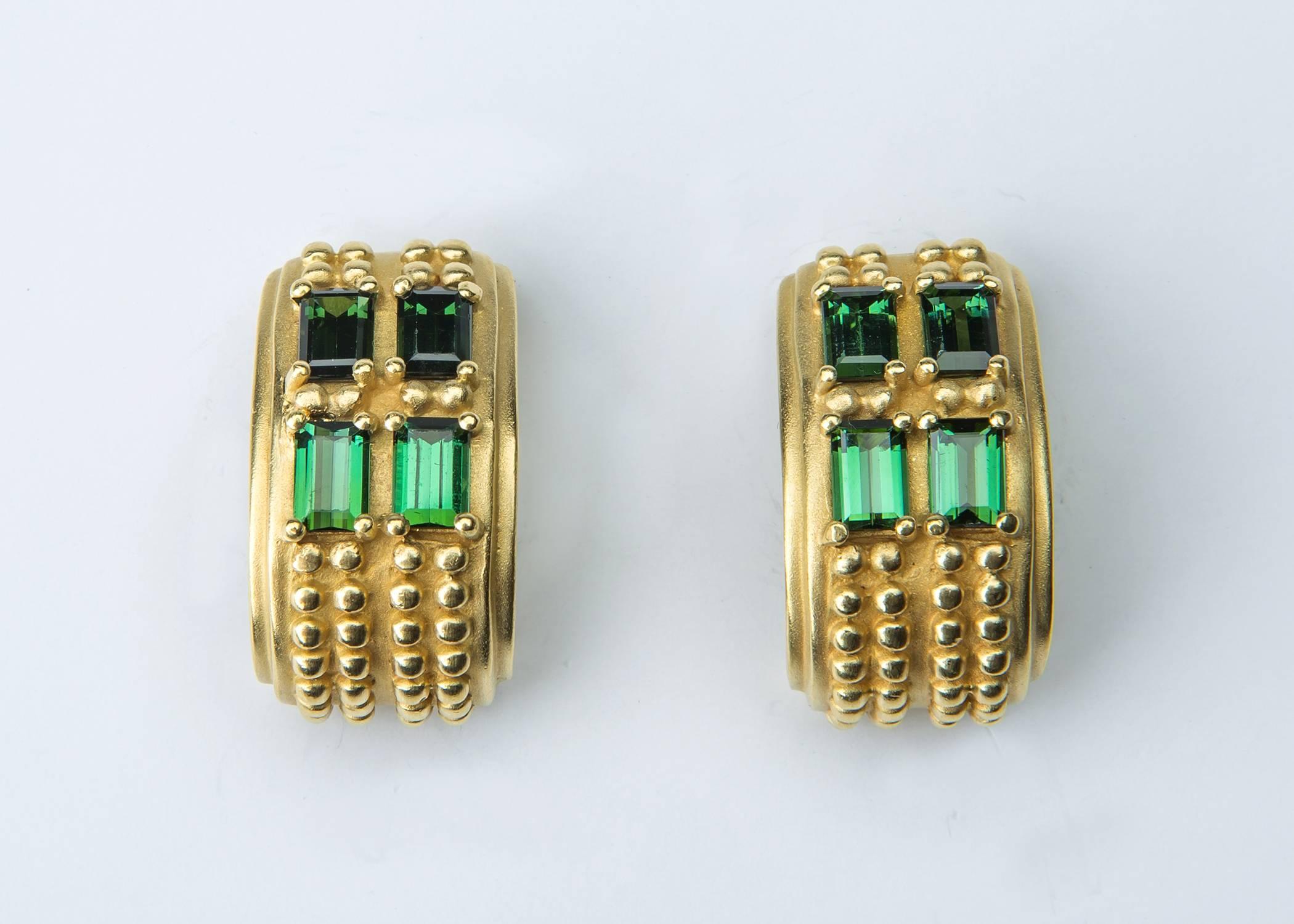A great example of Barry Kieselstein - Cord's timeless designs and exceptional quality. Vivid green tourmalines are perfectly matched and framed  with rich beaded gold. 1 inch in length. 
