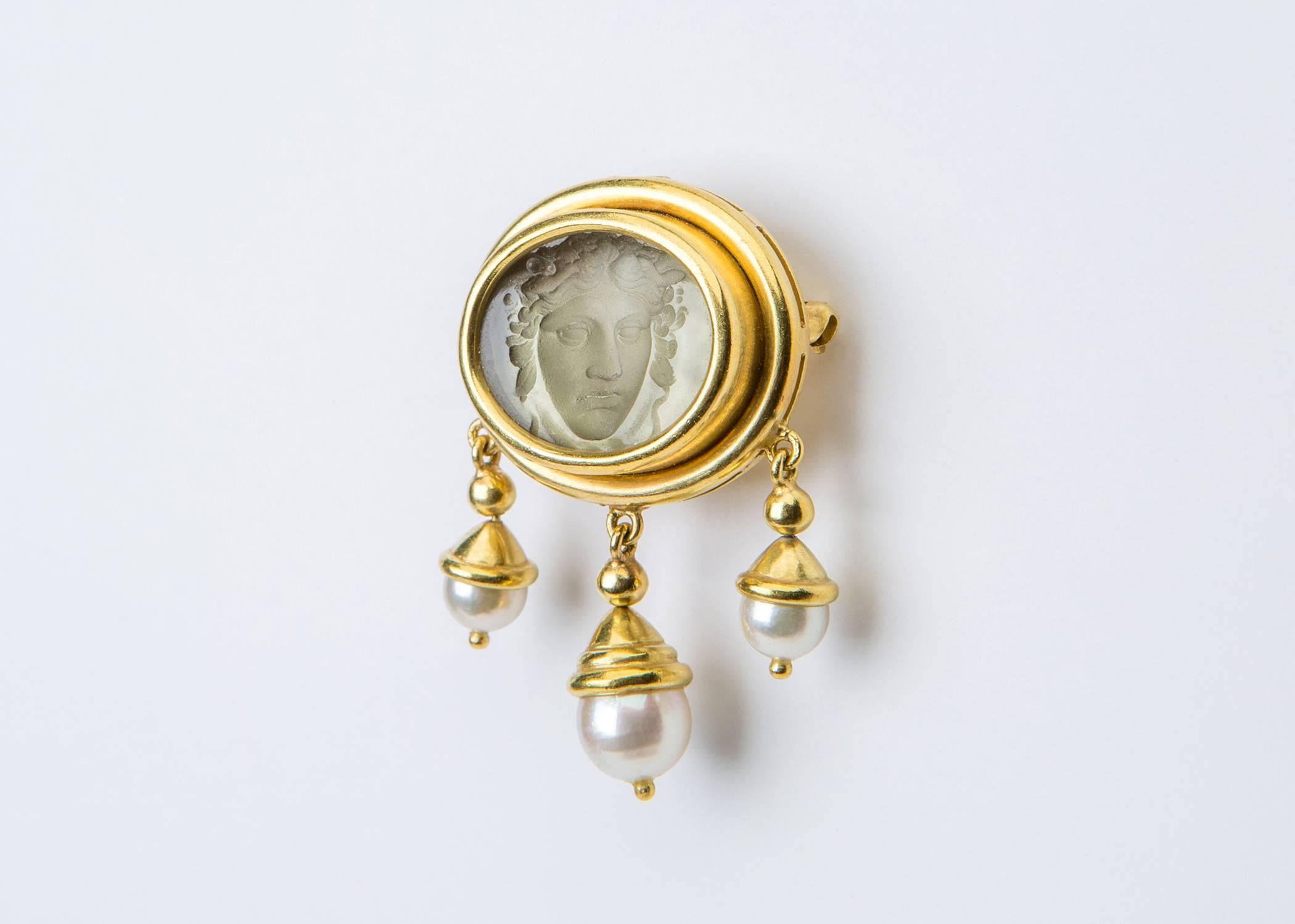 A dramatic Venetian glass intaglio is framed with an elegant double bezel and finished with three beautiful cultured pearls. Wear this as a pin or pendant. 1 1/8 inches across by 1 5/8 inches in length. Pure Elizabeth Locke style and quality.