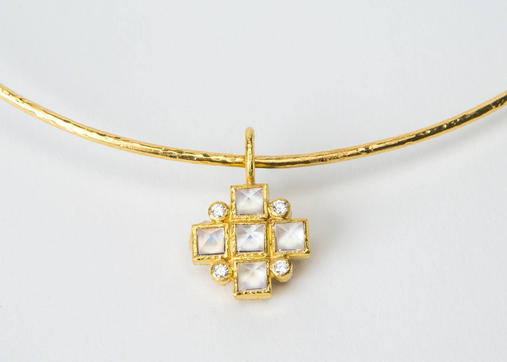 Pyramid shaped moonstones and brilliant cut diamonds create a classic maltese cross pendant suspended from a simple neck wire. Simple wearable style from Elizabeth Locke. The pendant is just under 1 inch in length,