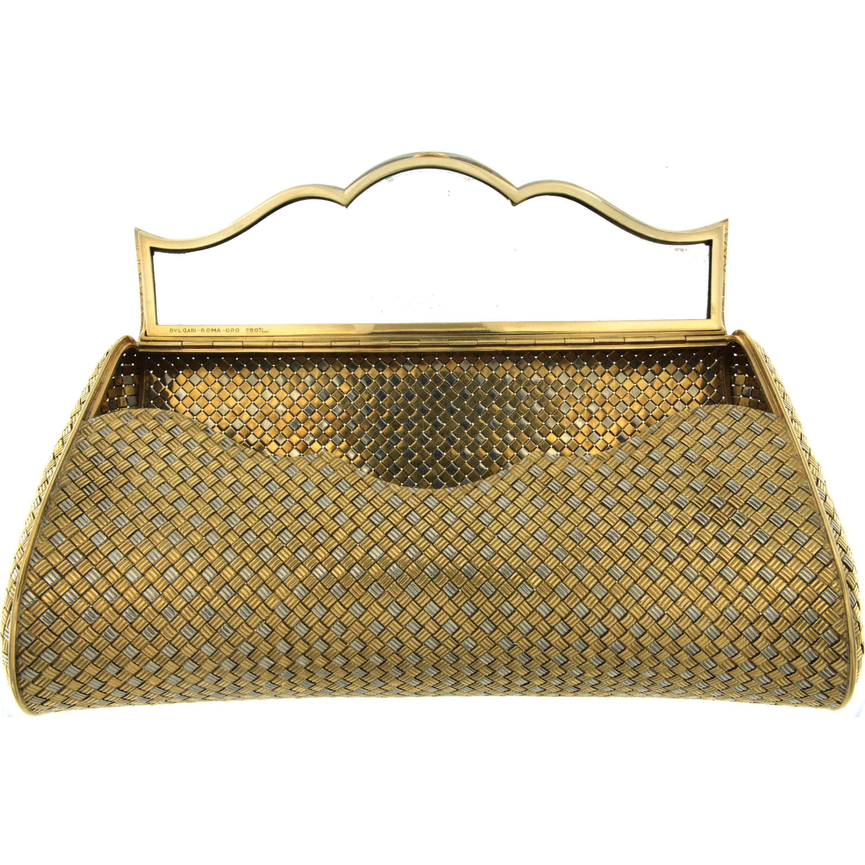 An Elegant White and Yellow Gold Evening Bag by Bulgari. 

A Magnificent craftwork circa 1980 opening to reveal a fitted mirror.
Made of solid 18k Gold marked and Signed 
