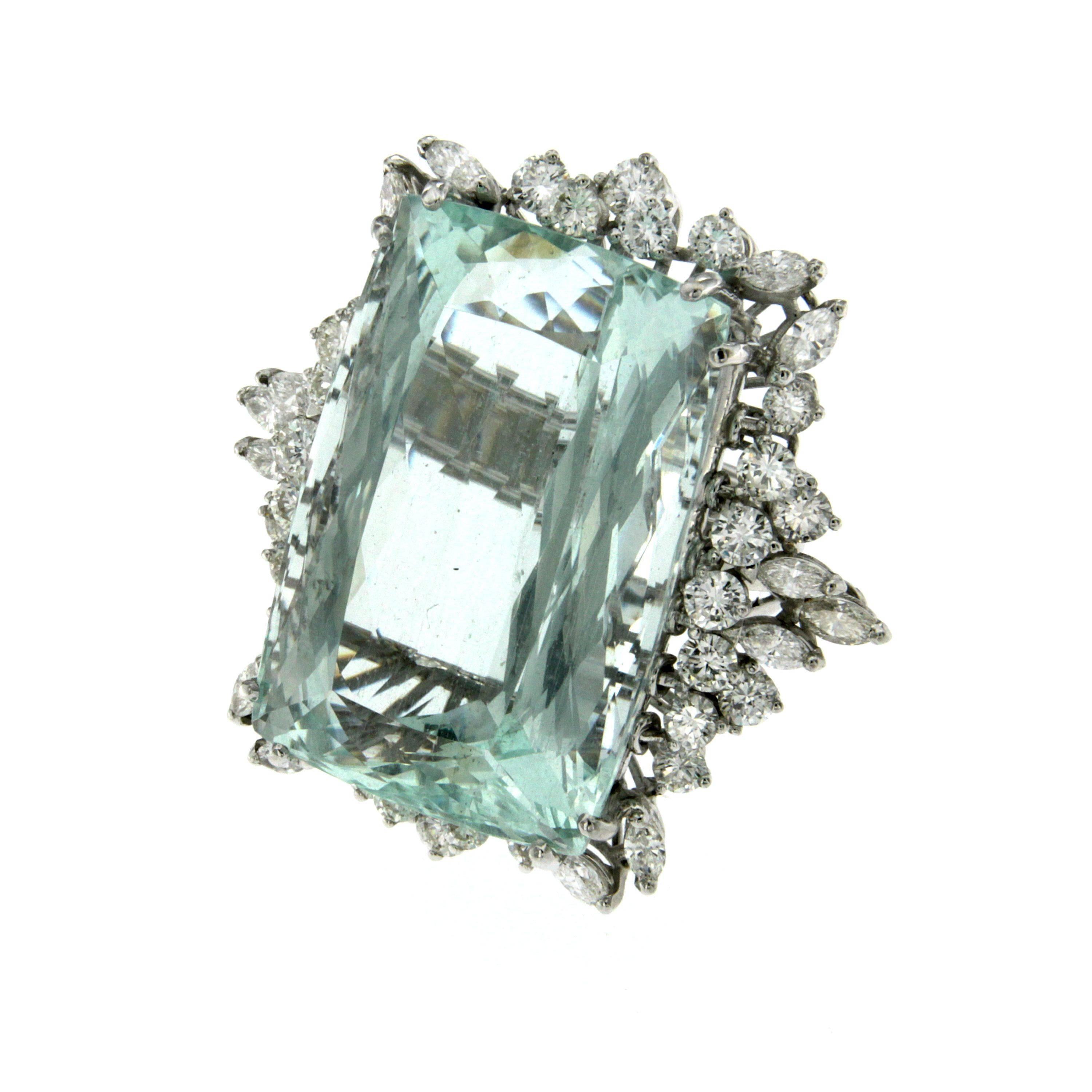 Unique acquamarine Ring mounted in 18k white gold and set in the middle with a rare and wide natural Aquamarine of 80 carat weight and surrounded by 3,50 carat of sparkling Diamonds round and navette cut graded G/H vvs2.

Ring measures: long 1,53