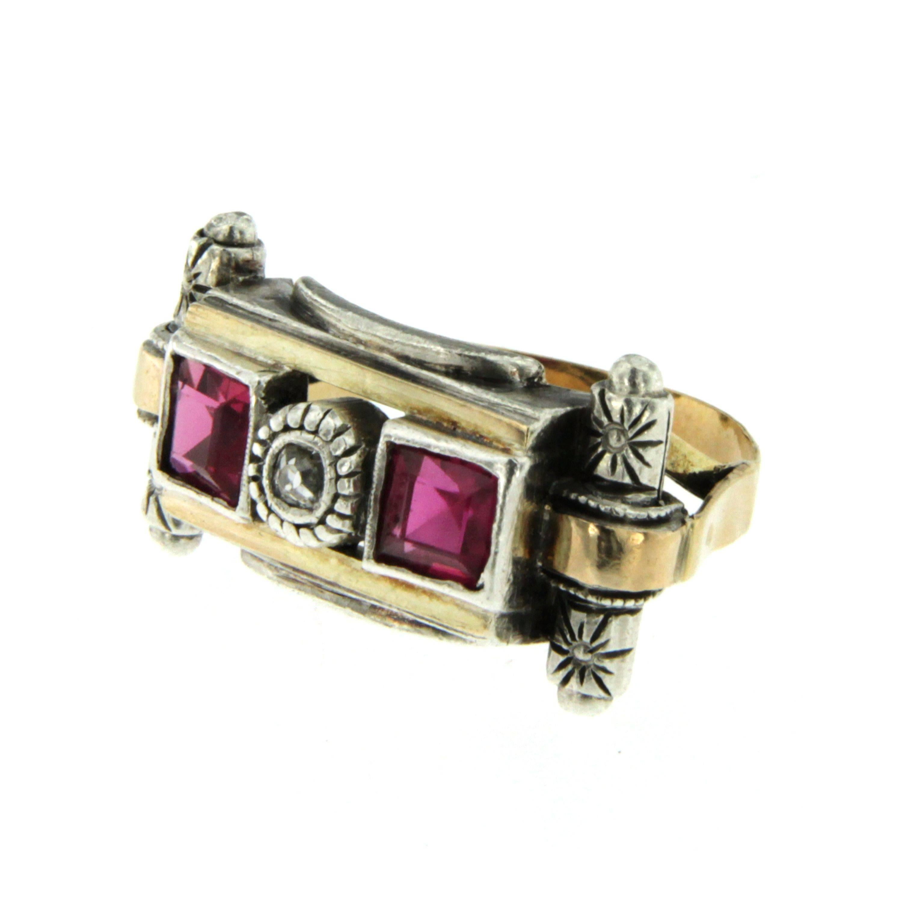 An Unusual Art Deco piece from 1930s set with one European cut Diamond in the center and two semiprecious stone square cut in the sides all mounted in a handcrafted 14K gold and silver mounting.   

Ring Size: US 6,5 - IT 13 - FR 53 - UK N  This