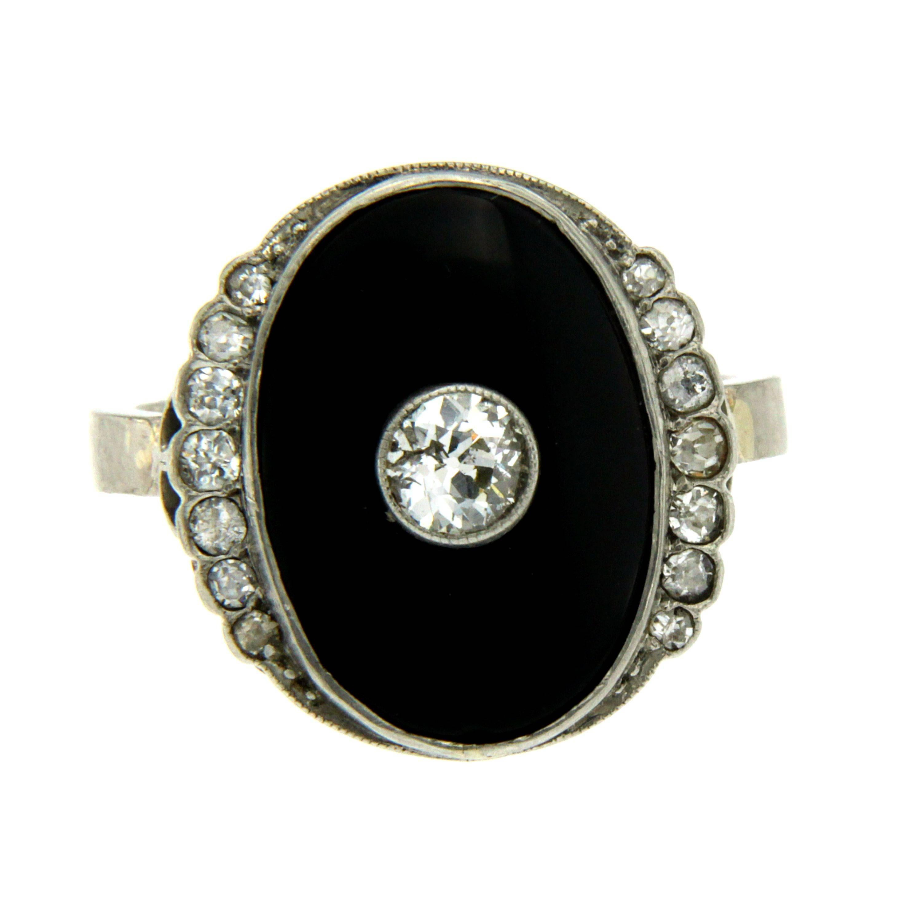A magnificent Art Deco ring, featuring round cut diamonds, surrounded by onyx and a fine diamond surround, set in 18k gold.
Total diamond weight: about 0.50 carat. G color Vvs2 clarity

Gross Weight: 8.1 Gr.
Ring Size - US 10 - IT 22 - FR 62 -