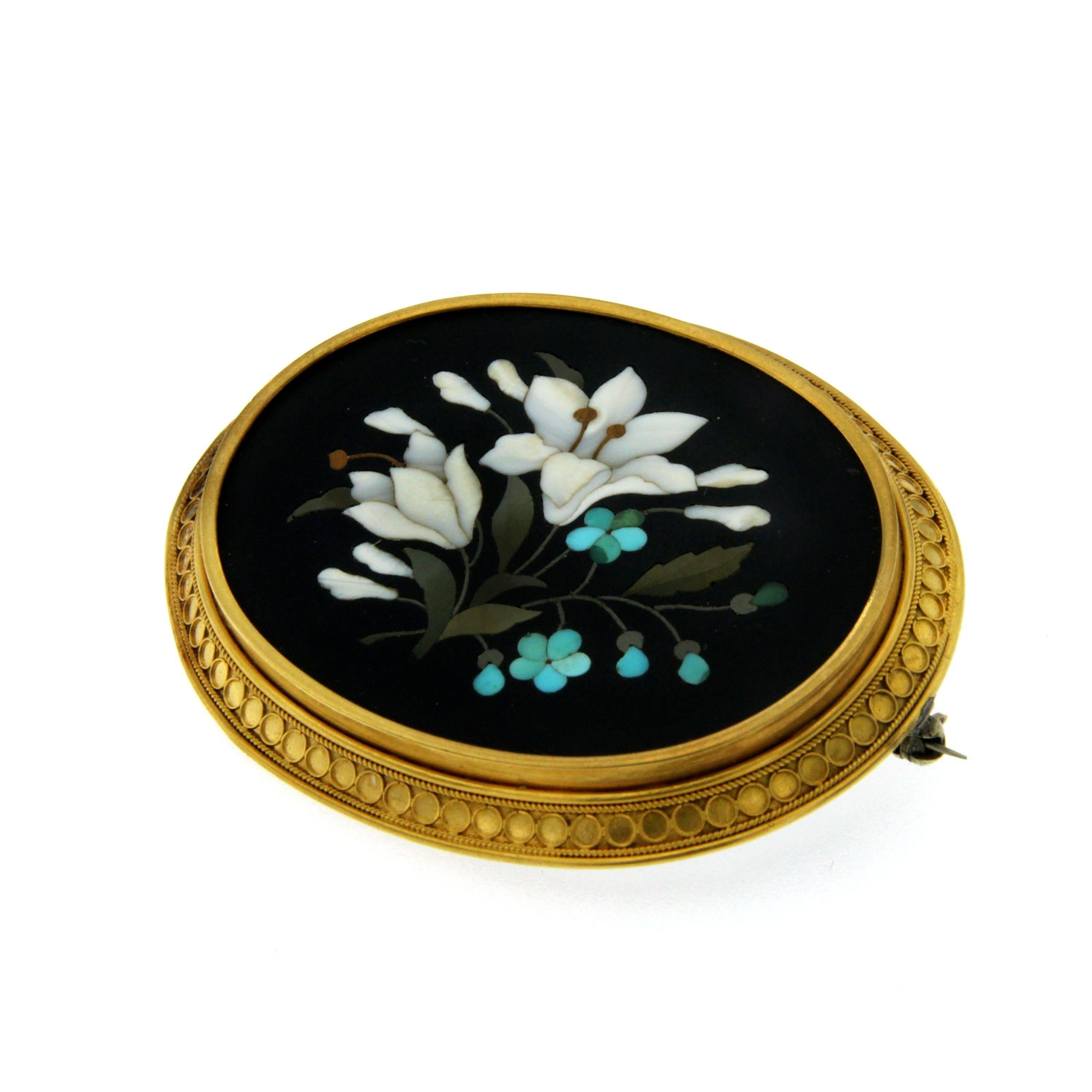 A  gorgeous  Mosaic set of earrings and brooch mounted in 18k yellow gold.
The brooch and the earrings feature a flower bouquet, on black ground within reeded bordered setting.
The brooch has a locking c-clasp fastener.
The craftmanship on this