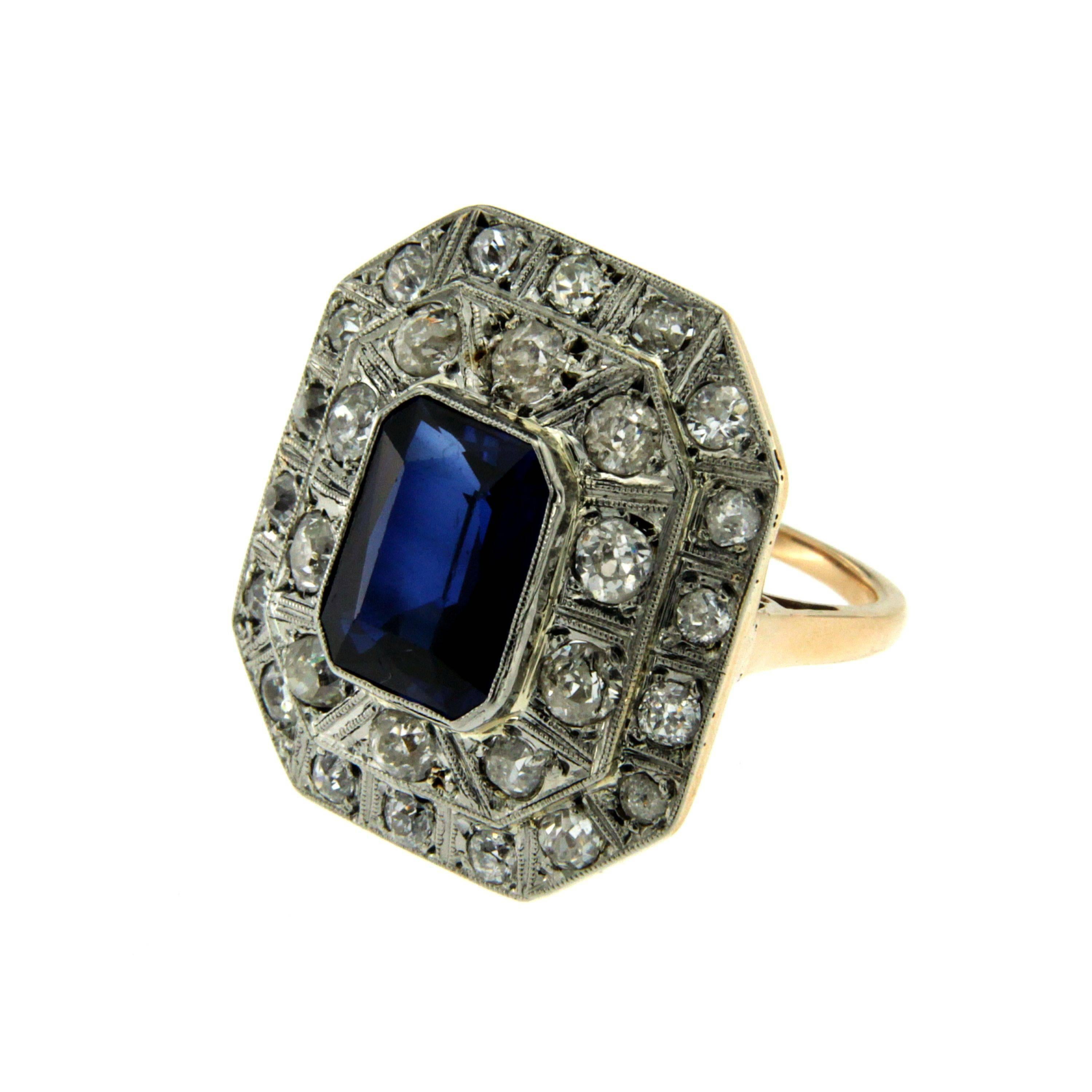 Beautiful Cocktail ring from 1950, set around with 1,60 carat of sparkling old cut Diamonds, graded H/I color vs and in the center one wide verneuil synthetic corundum. 
This ring is designed and crafted entirely by hand in the traditional way,