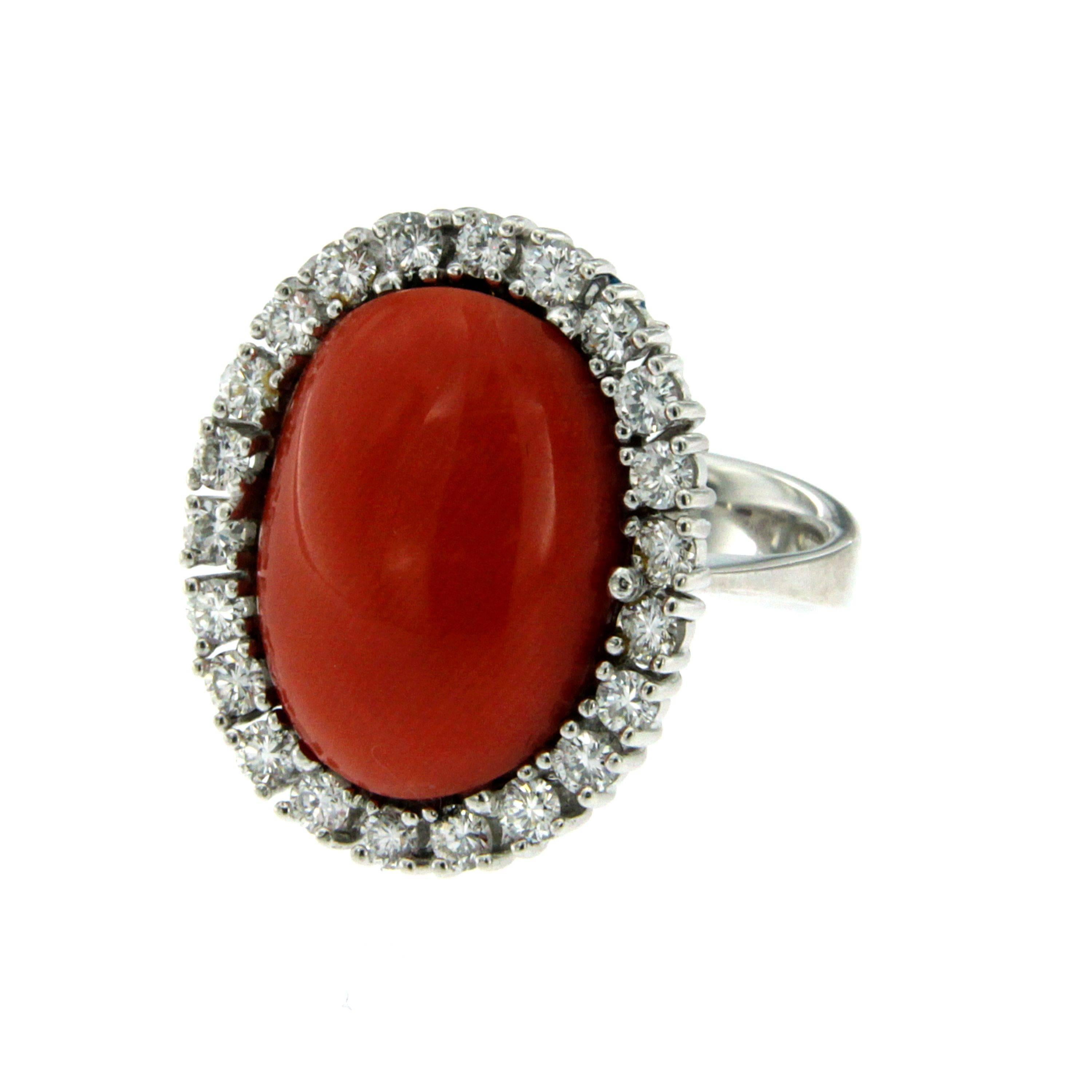 A beautiful vintage ring out from 1960s Origin Italy, hand crafted of solid 18Kt white gold. 

The ring feautures a Natural wide Cabochon Coral, of the greatest variety, Rubrum, 100% natural not dyed or worked with any resin or other synthetic