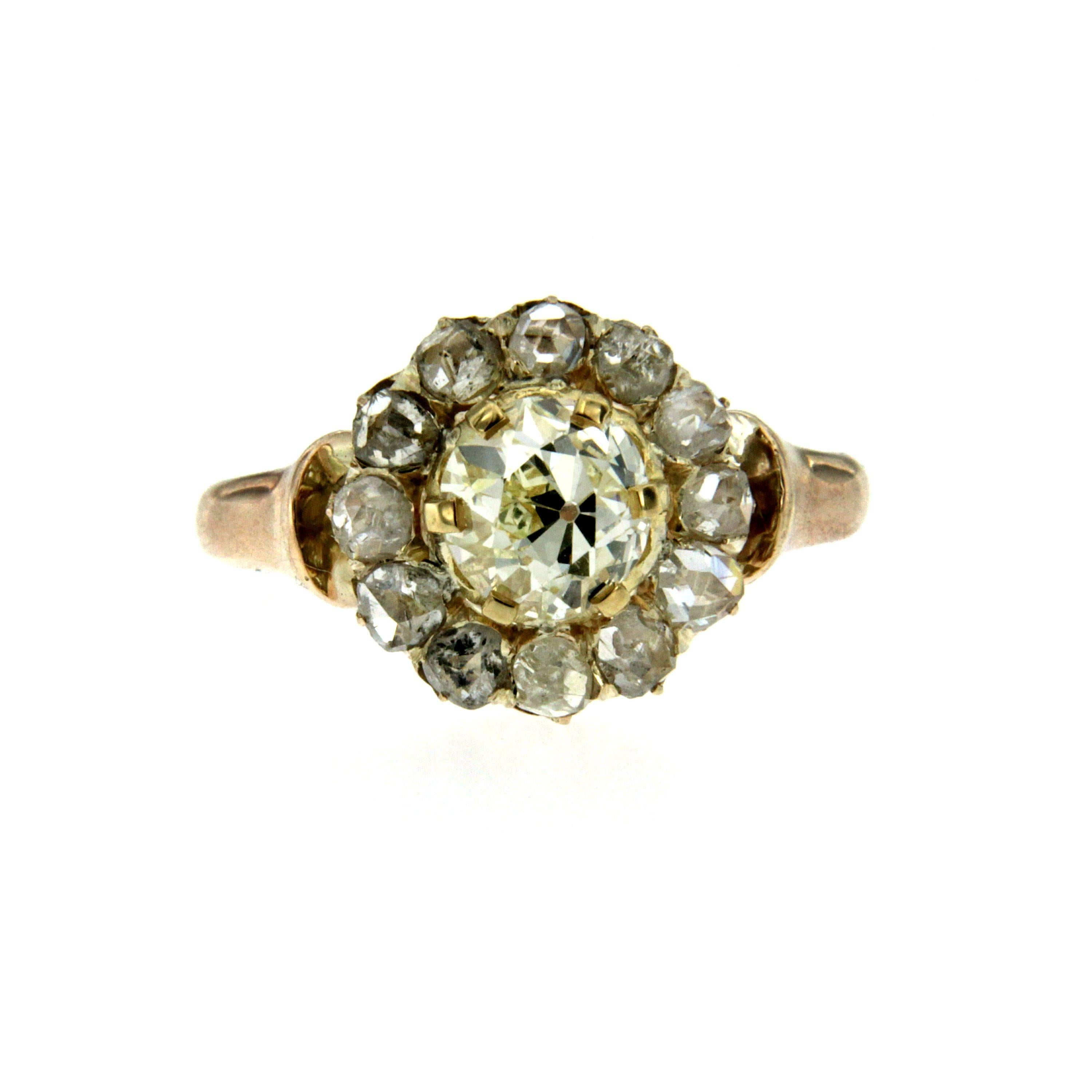 This beautiful cluster diamond ring dates 1890s. The pretty flower head sparkles with 0.97 ct of old mine cut diamond and it is surrounded by 12 rose cut diamonds weighing 0.40ct.
Hand crafted in 18k rose gold. 

CONDITION: Pre-owned - Excellent