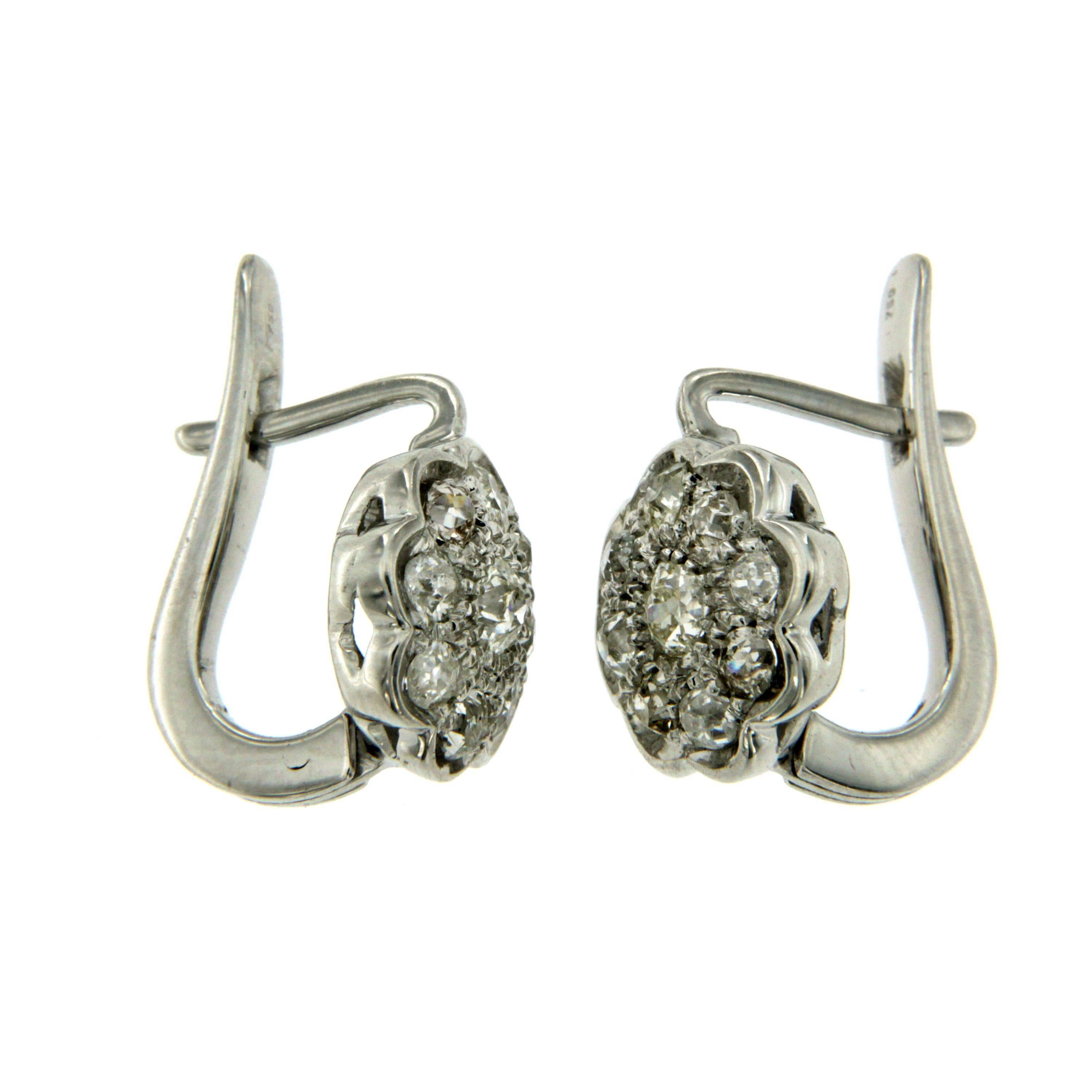 Cluster earrings in 18k white gold authentic from 1960 period.
The Earrings are mounted with approx. 2.00 carat of old cut Diamonds H-I color Vs clarity.

CONDITION: Pre-owned - Excellent 
METAL: 18k white Gold 
STONE: Diamond 2.00 total carats