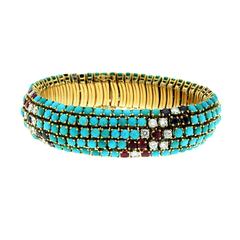 1970s Turquoise Sapphire Ruby Diamond Gold Bracelet 1970s Turquoise Sapphire Ruby Diamond Gold Bracelet